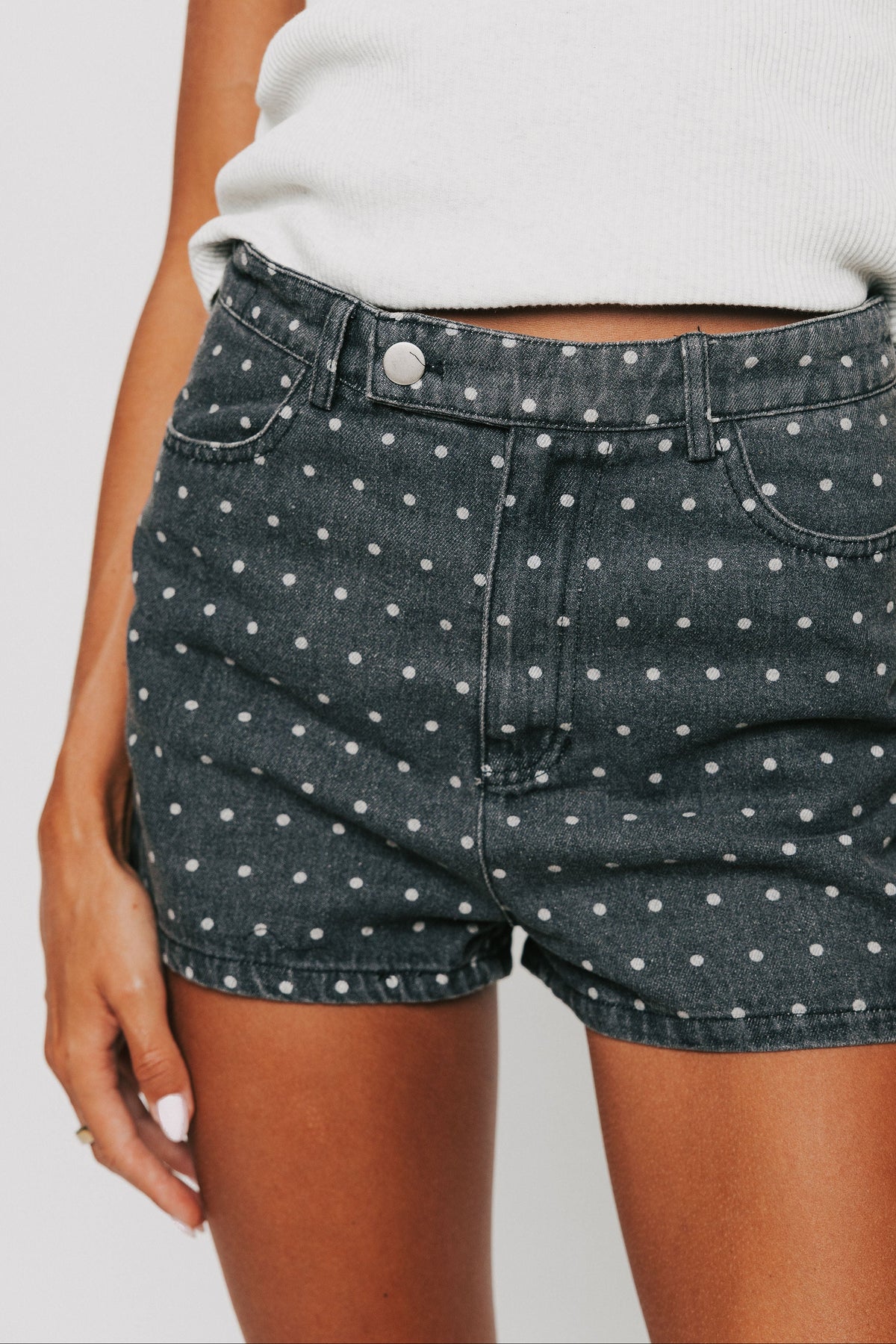 washed black denim polka dot shorts front