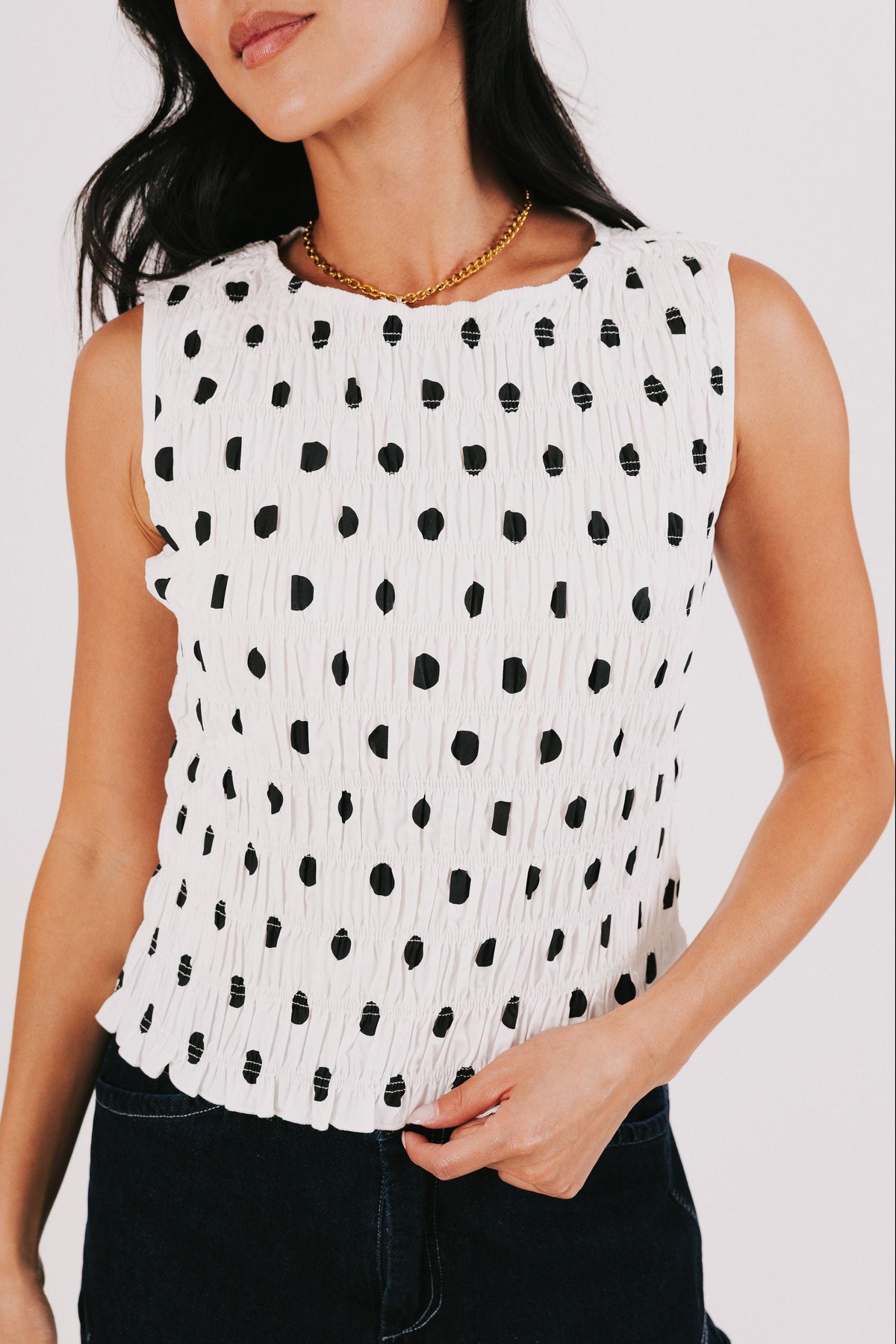 white and black smocked polka dot tank front
