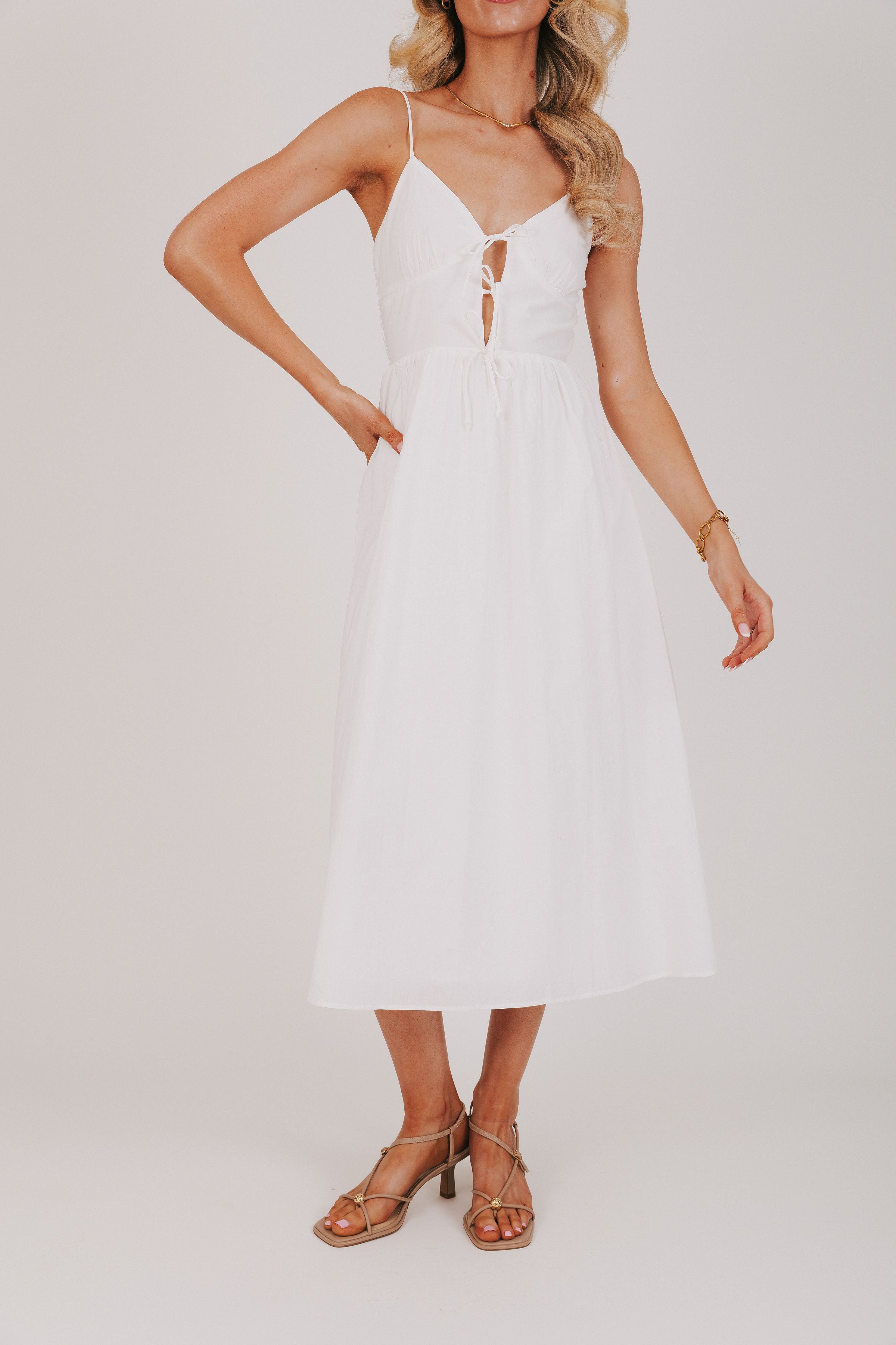 white midi dress with keyhole and bows on bodice