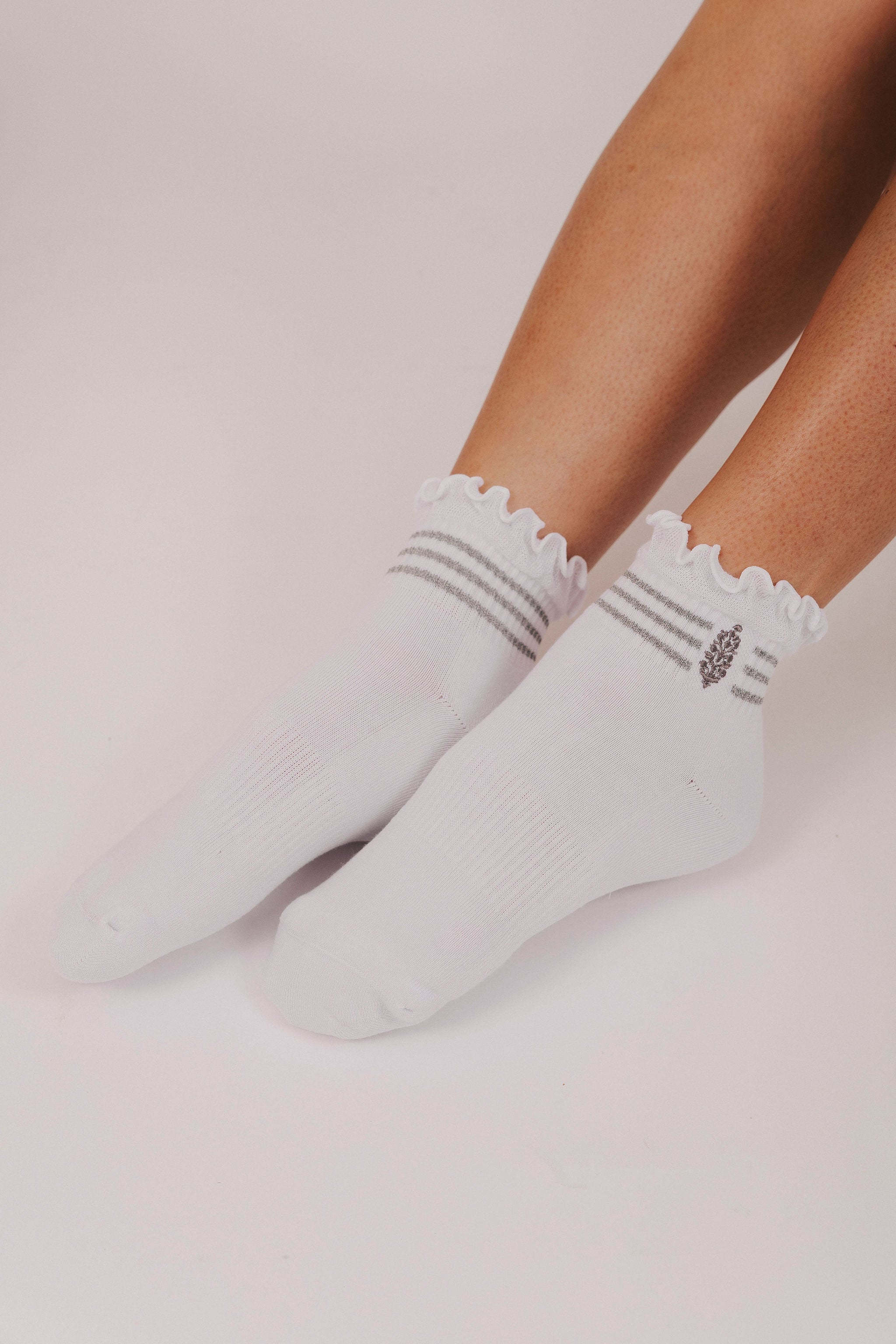 white ruffled socks with grey stripes
