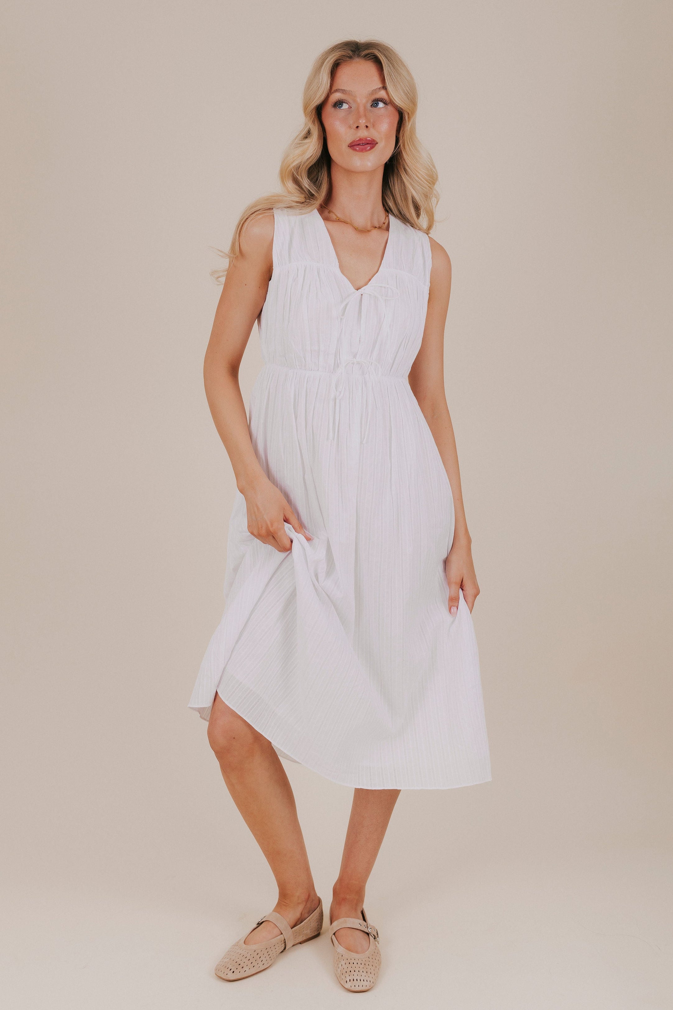 white sleeveless gathered lined striped dress front