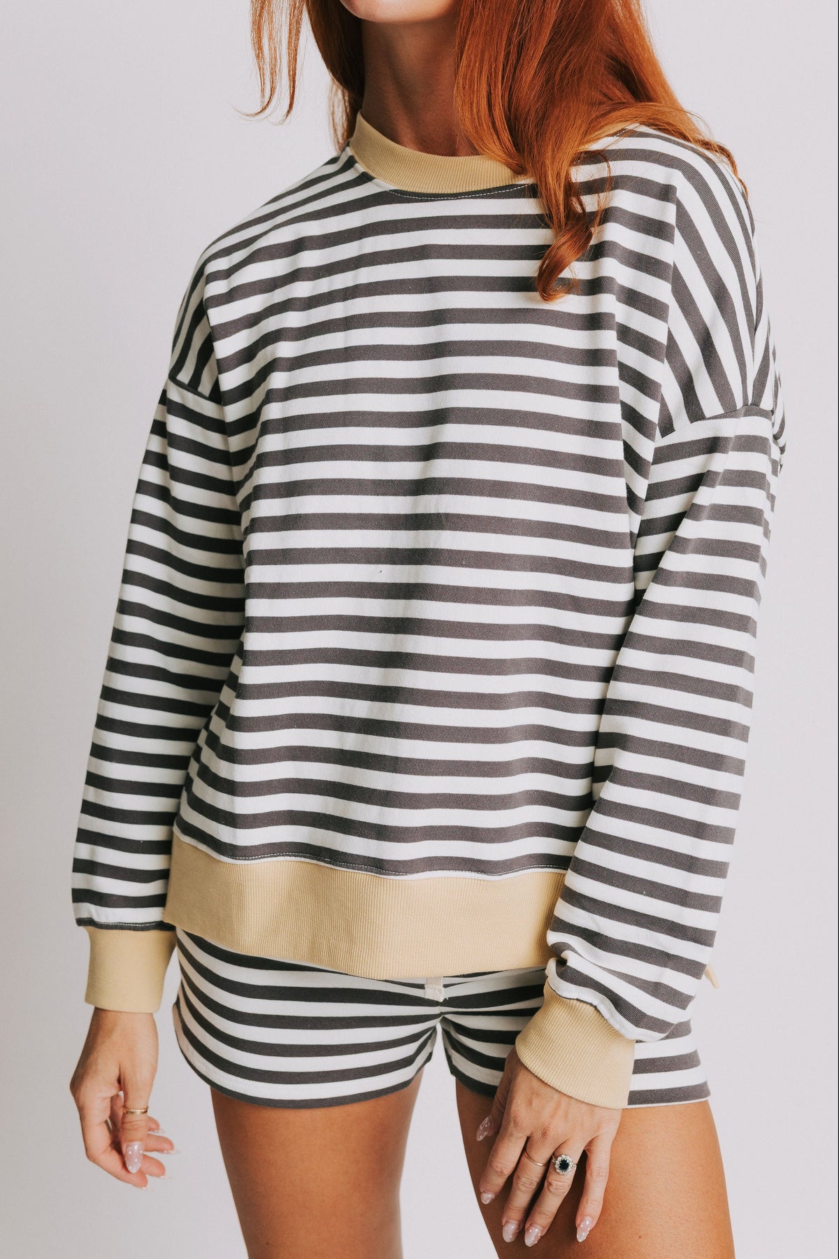 white striped long sleeve top with yellow trim front