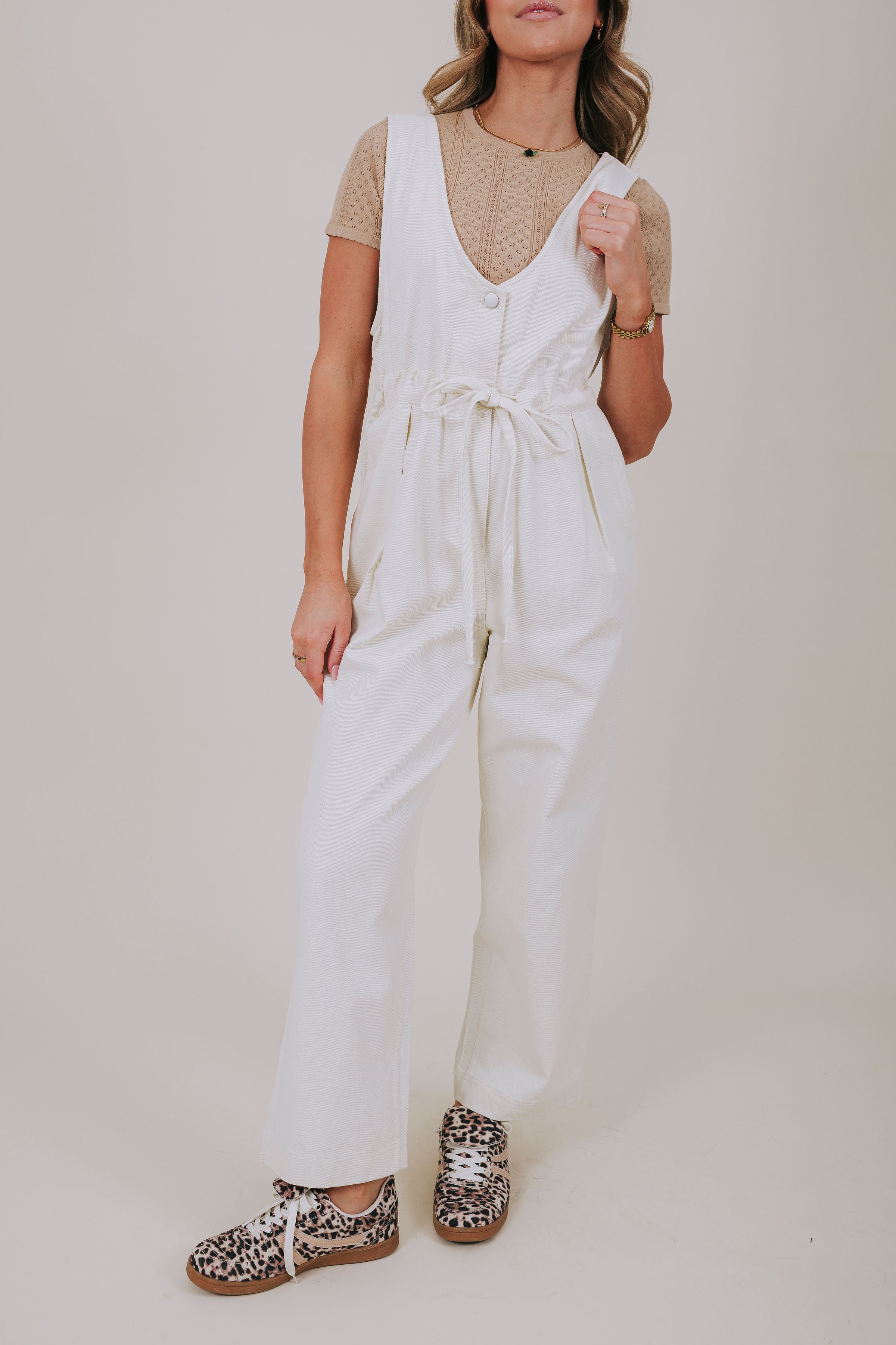 white v-neck jumpsuit close up