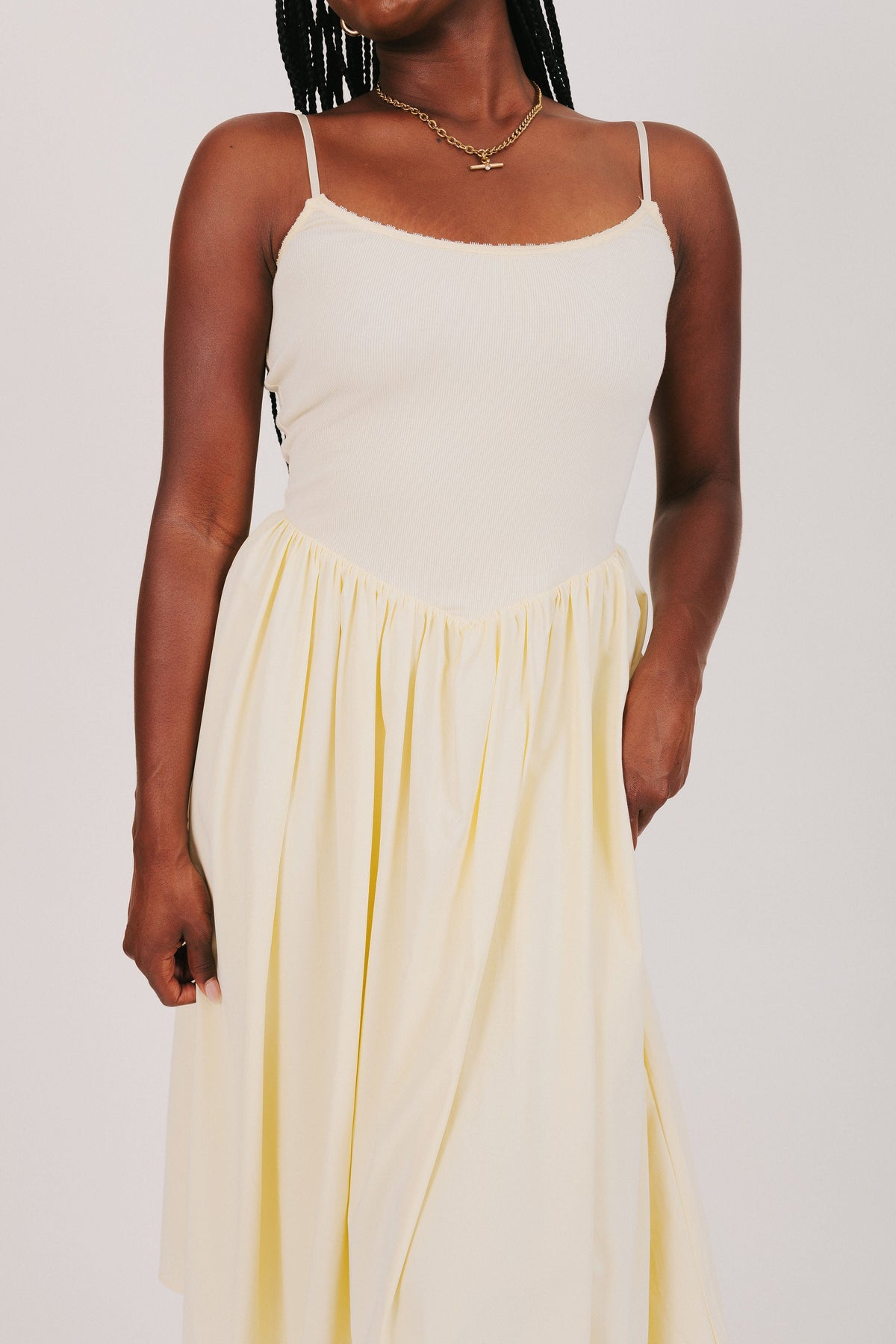 yellow spaghetti strap dress with flowy skirt