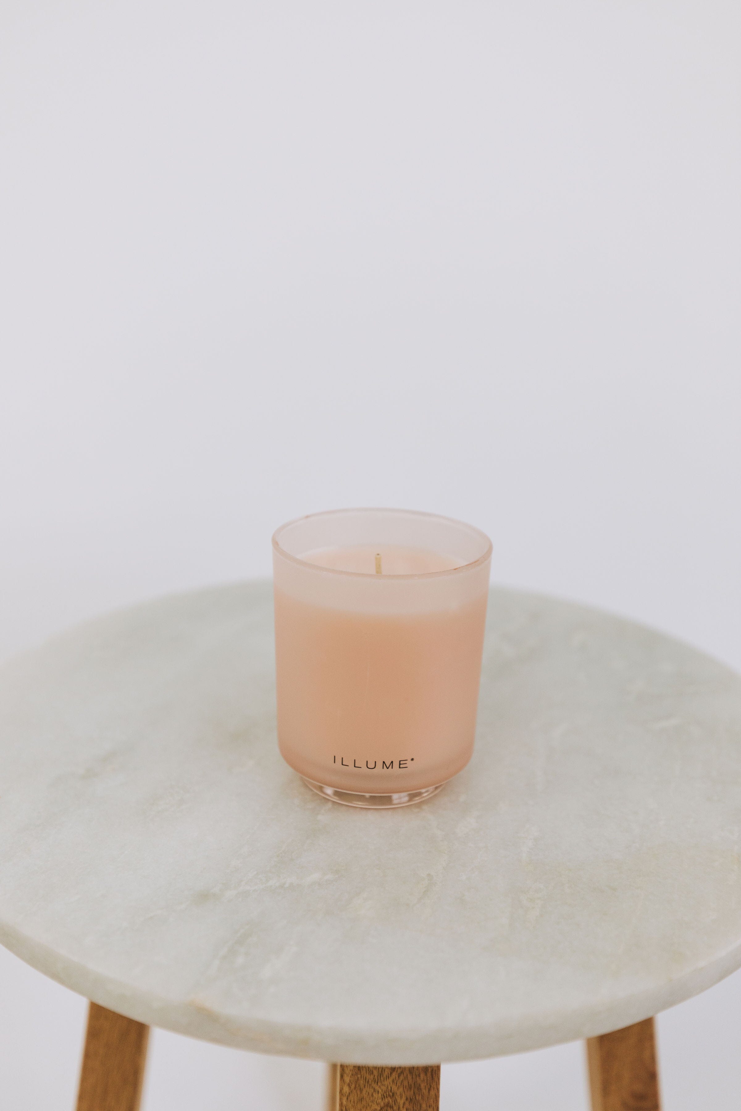 Pink candle in a glass holder