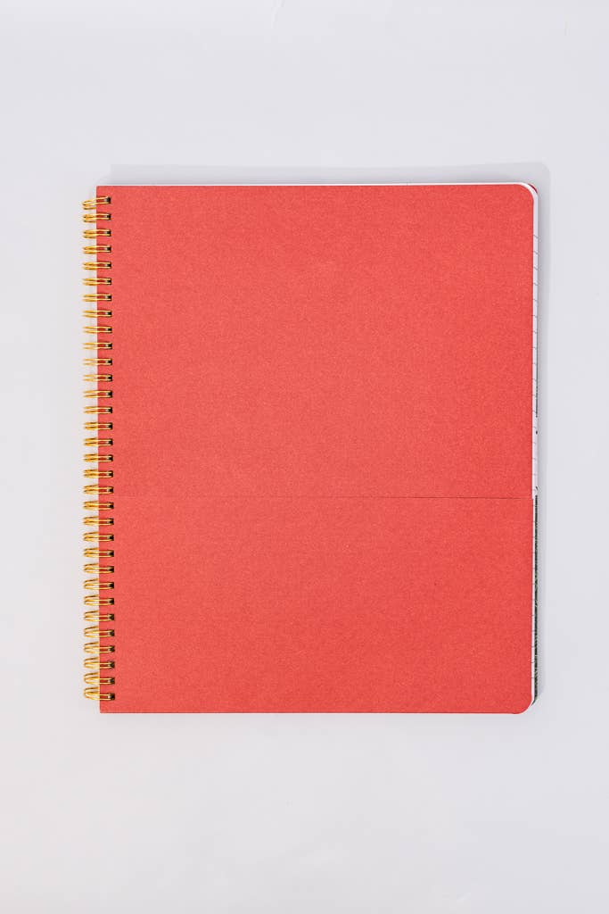 notebook with gold spiral binding on a light gray background red folder page 