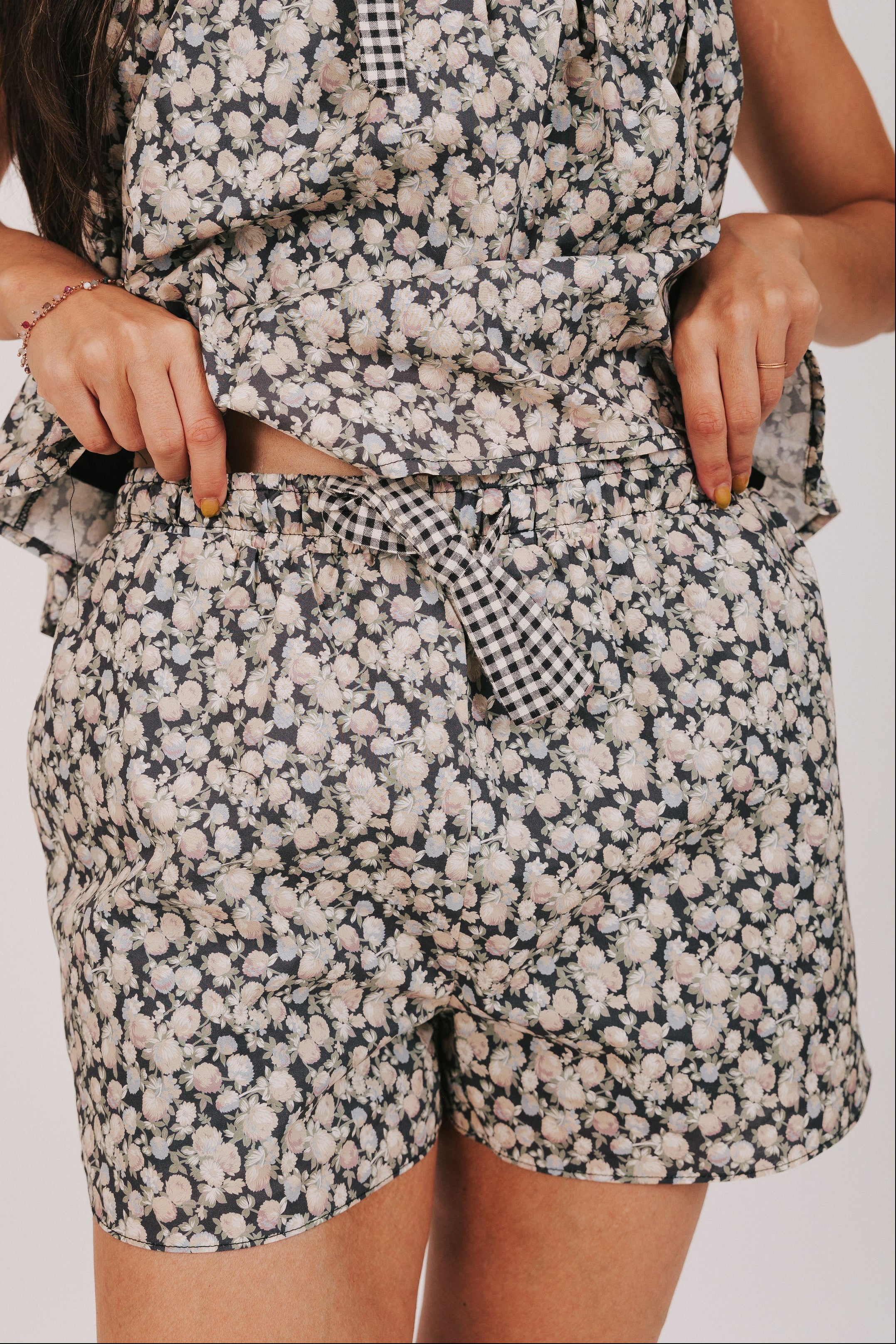 black floral print shorts with bow detail