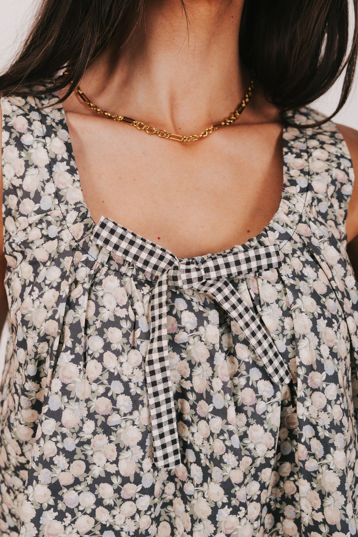 black floral print tank with bow detail close
