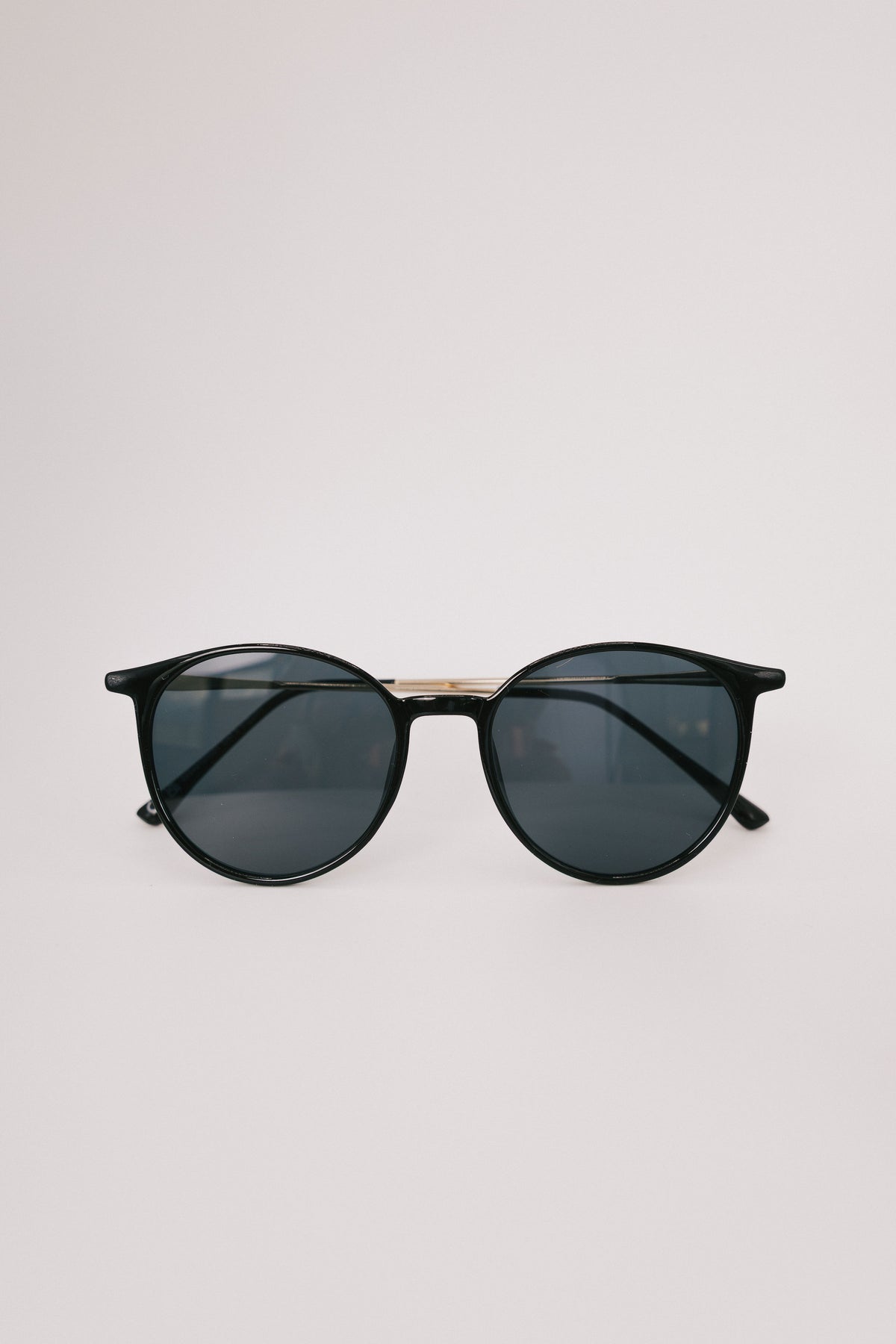 black round sunglasses display