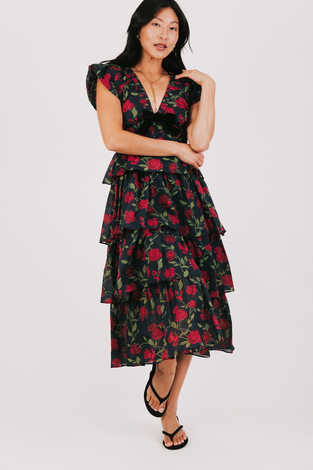 black tiered midi dress with rose floral pattern