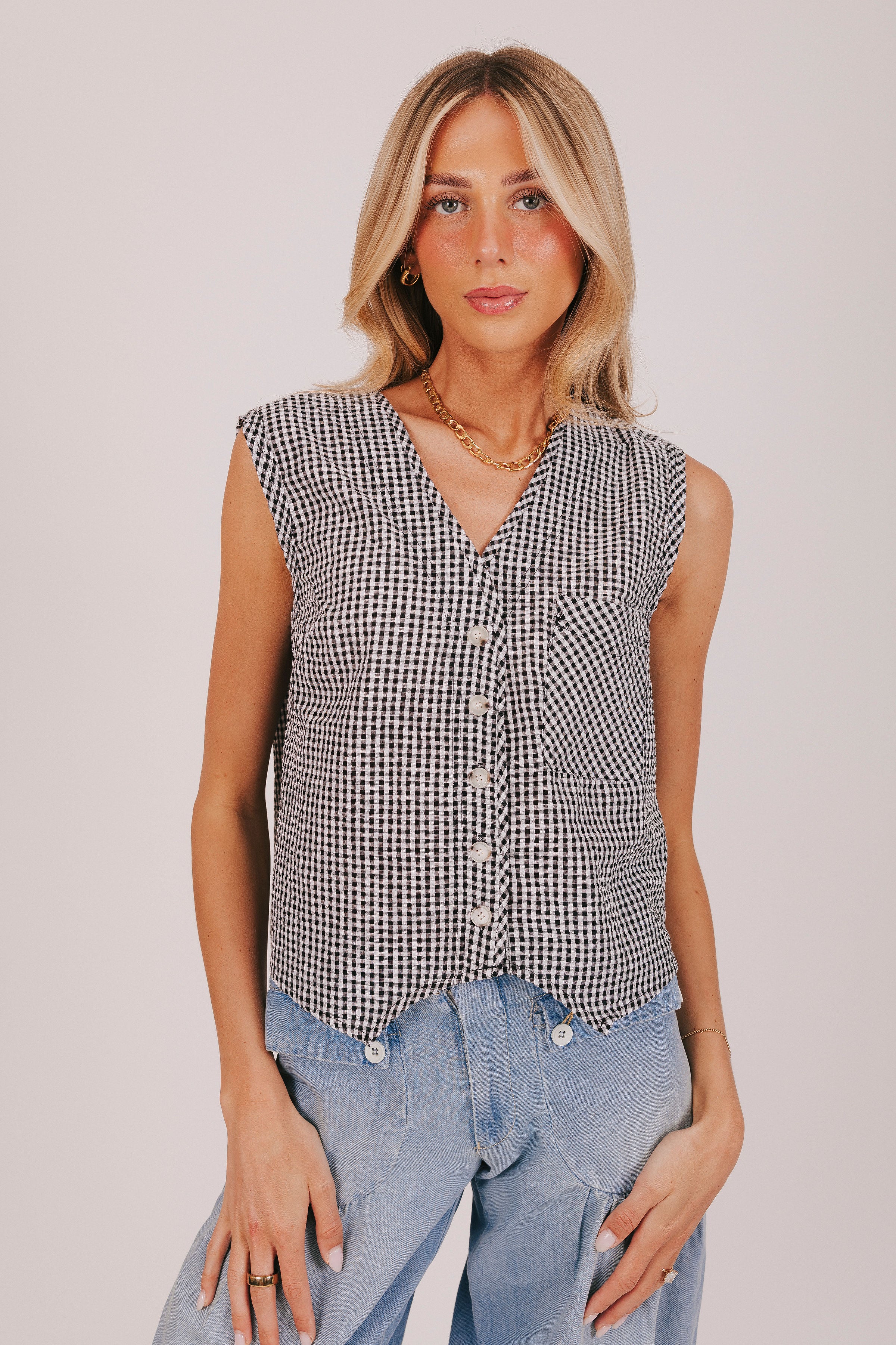 Black and white gingham top with button down front and front pocket 