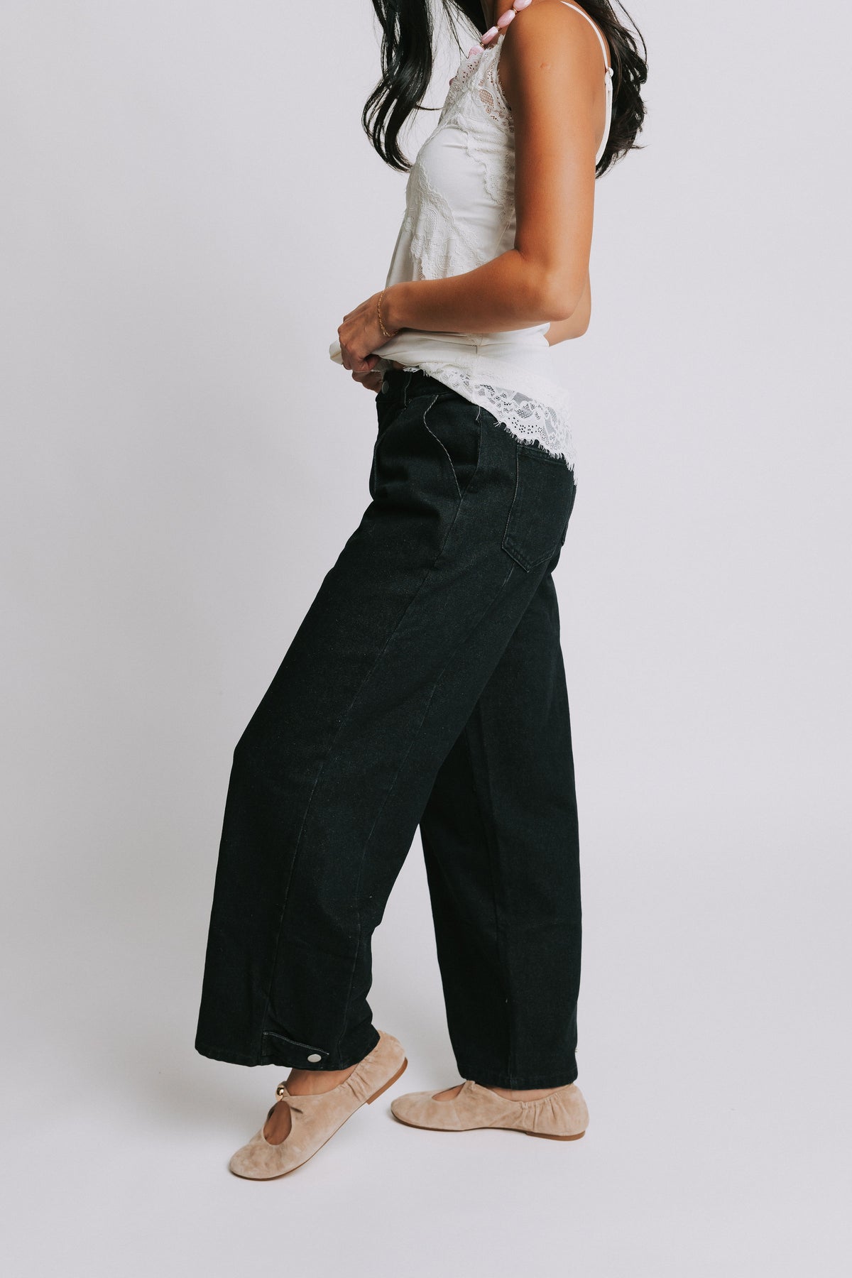 black wide leg jeans with snap adjustments side