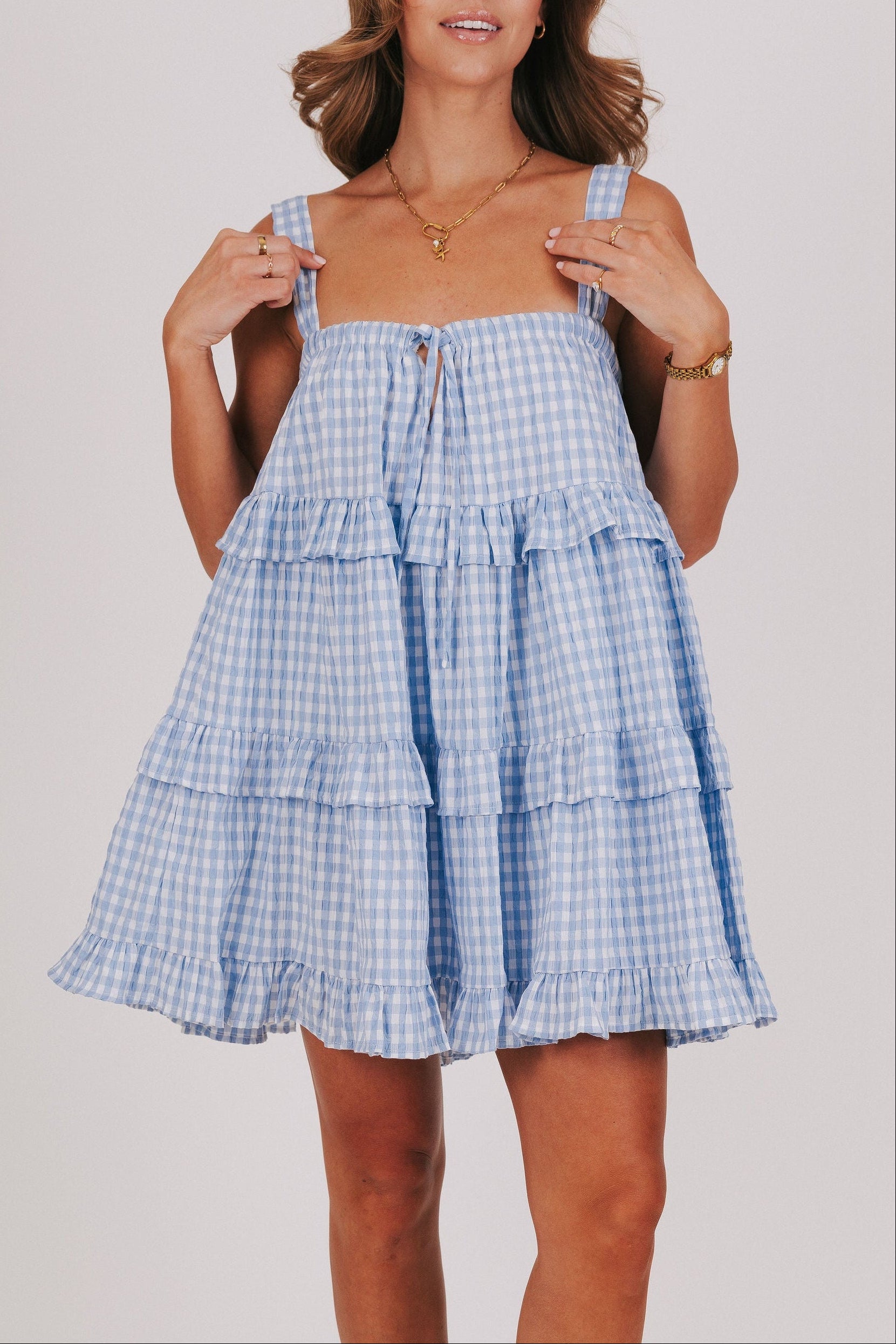 blue and white gingham tiered babydoll dress