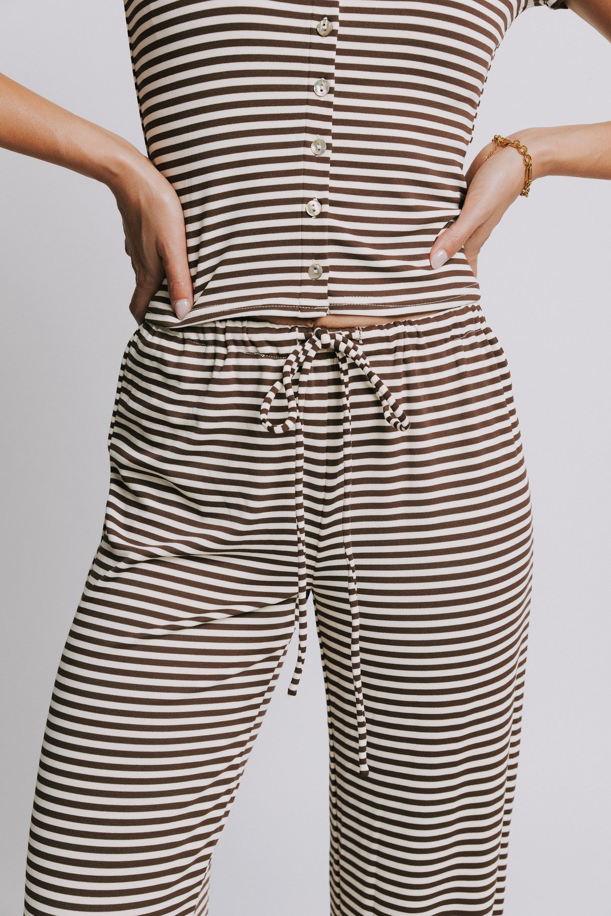 brown and cream striped pants with elastic waistband close