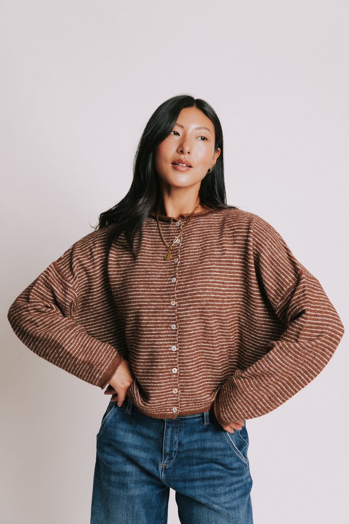 brown and white striped cardigan with rolled edges 
