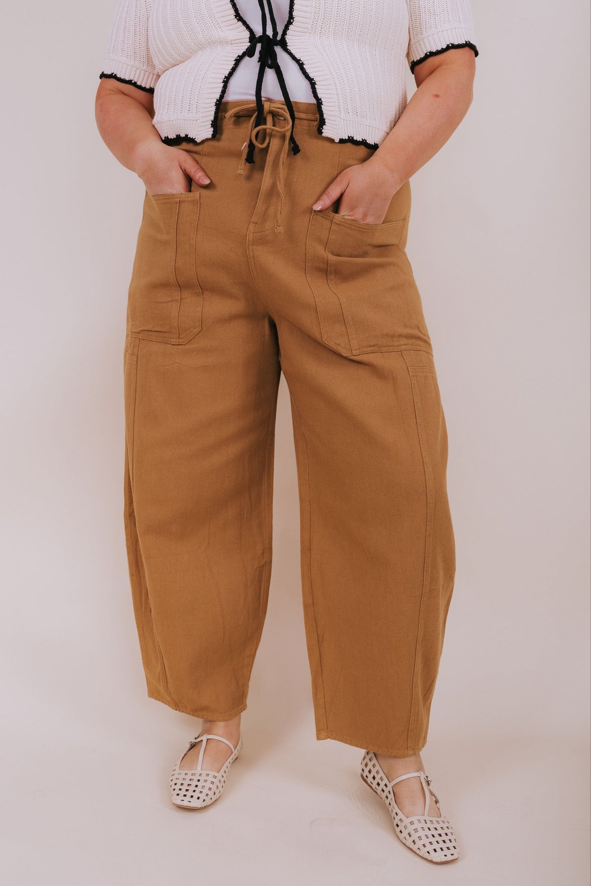 brown barrel jeans with oversized pockets and tie at the waist