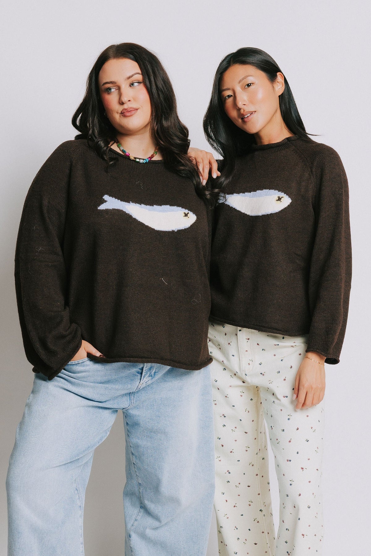 brown sweater with knit fish on the front models