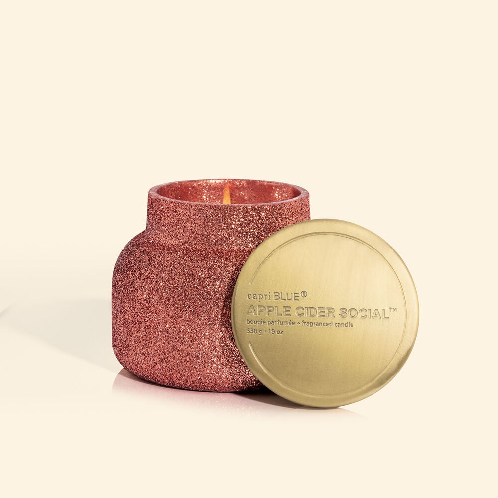 Sparkly pink candle with a gold lid