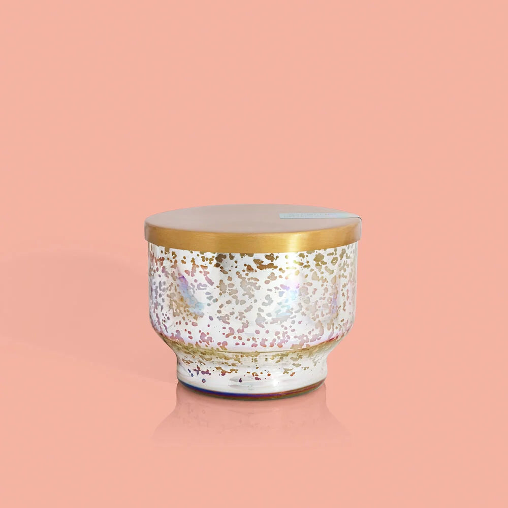 A white and gold Mercury iridescent inverted jar candle from Capri Blue.