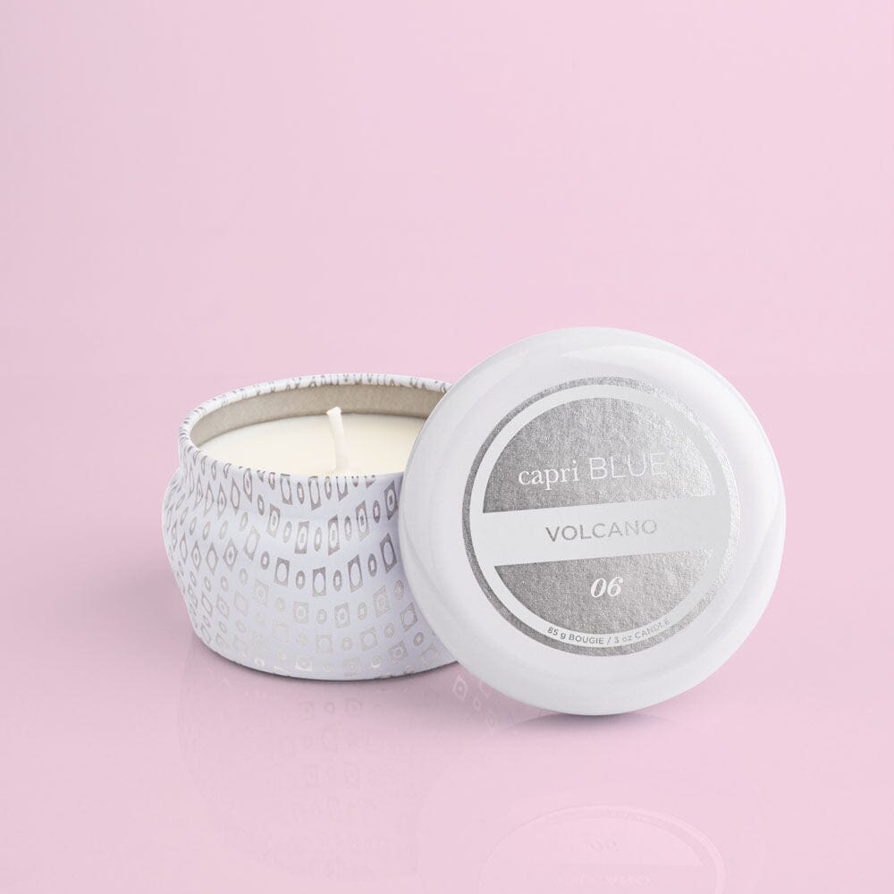 capri BLUE candle with lid on a pink background