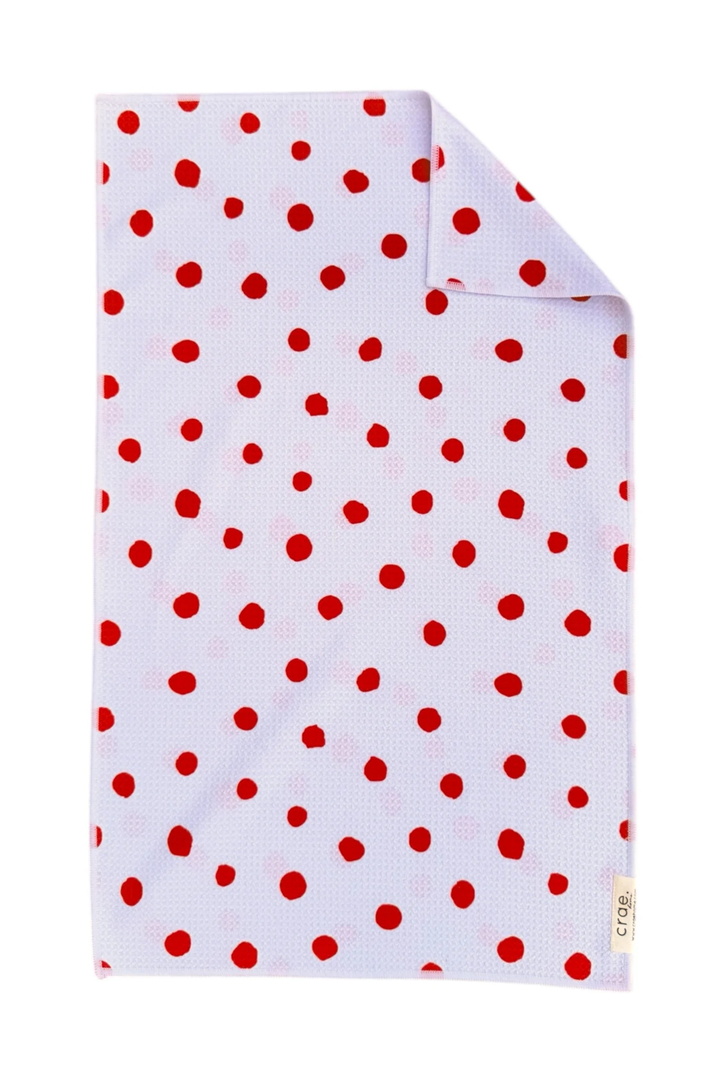 White microfiber hand towel with red polka dots