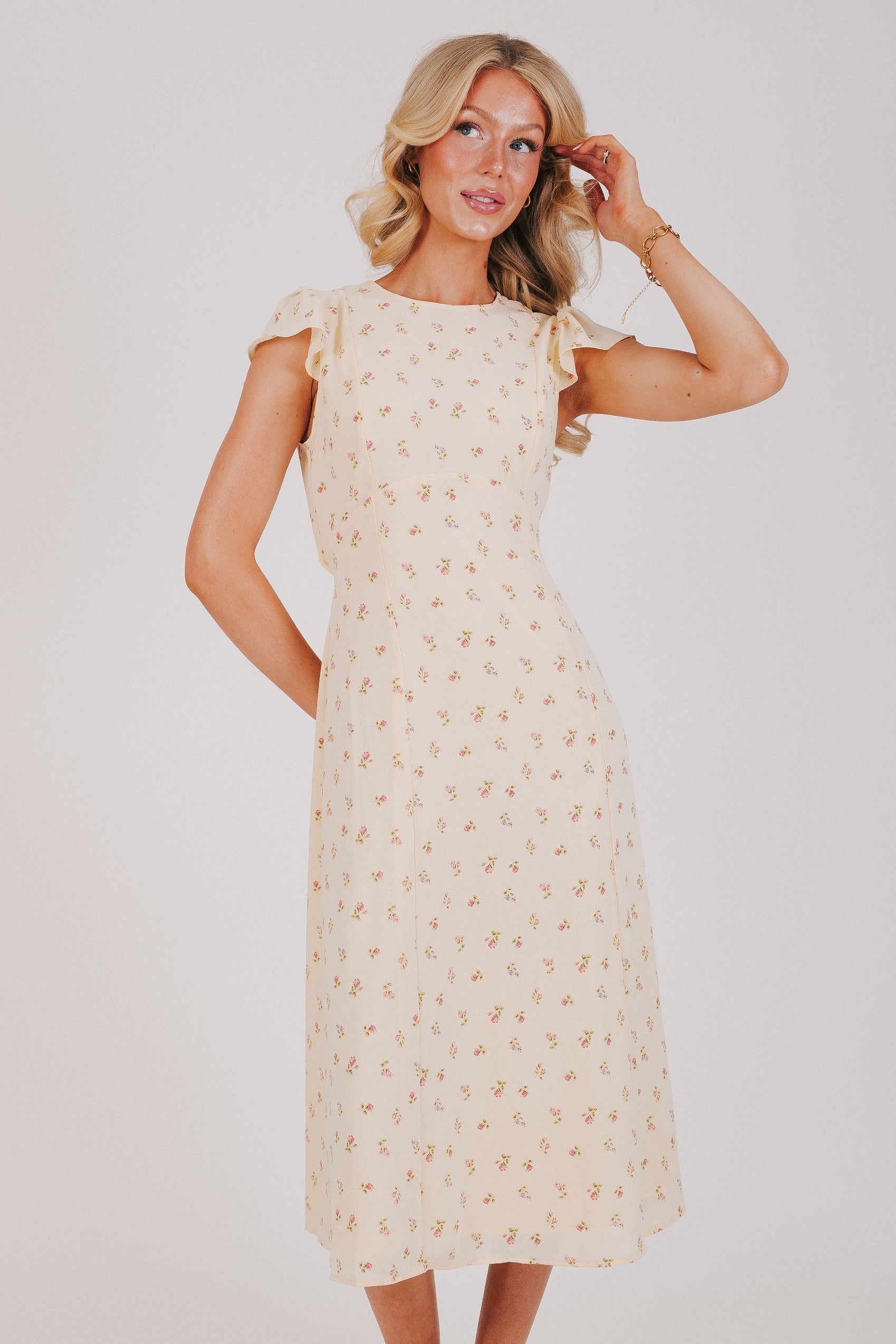 cream floral dress with flutter sleeves