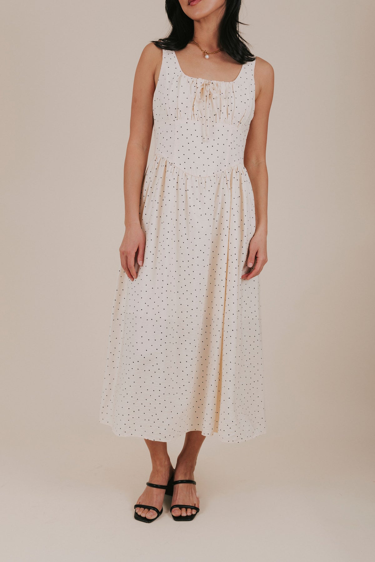 cream polka dot midi dress close