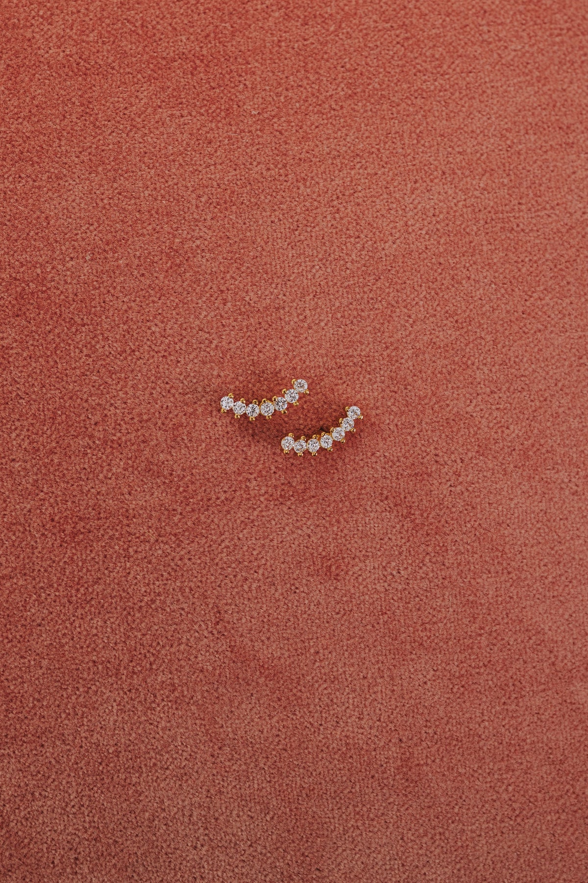curved zirconia studded earring flatlay 2