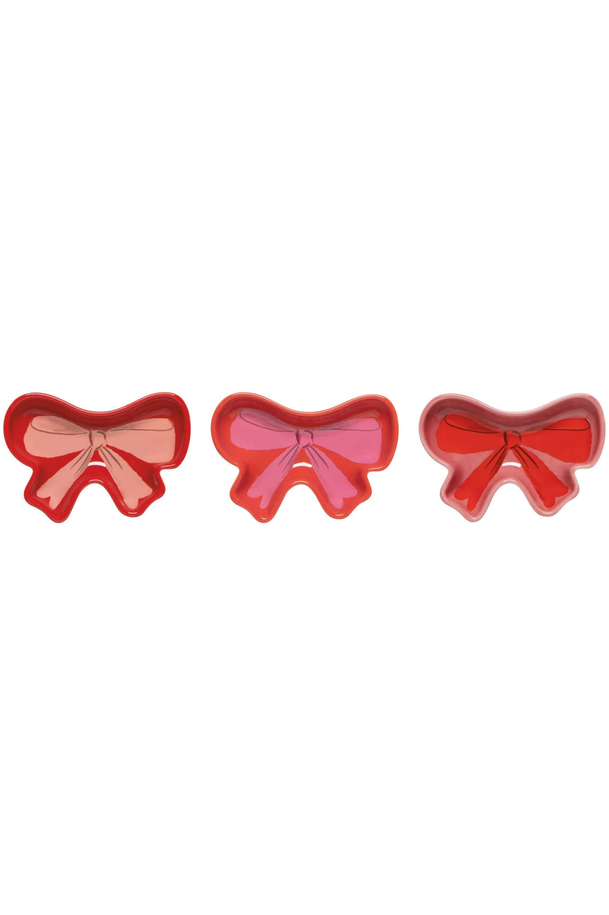 3 bow shaped dishes in pinks and reds 