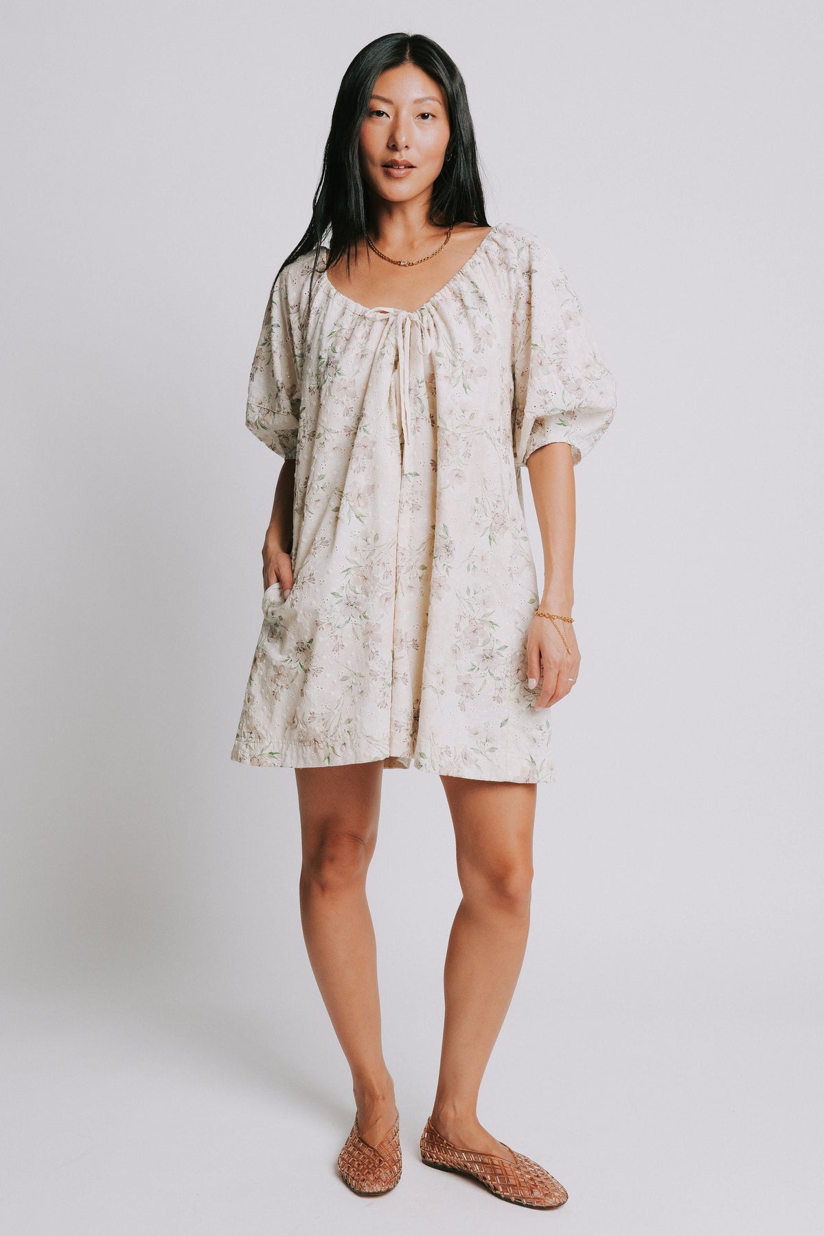 eggshell floral romper with adjustable neckline front
