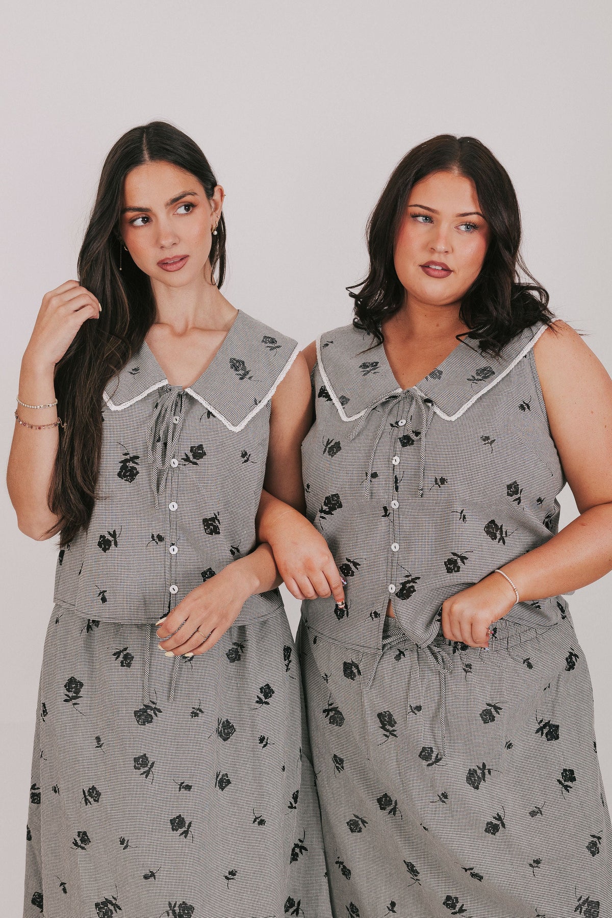 gingham sleeveless top with sheer black flowers and buttons down the front