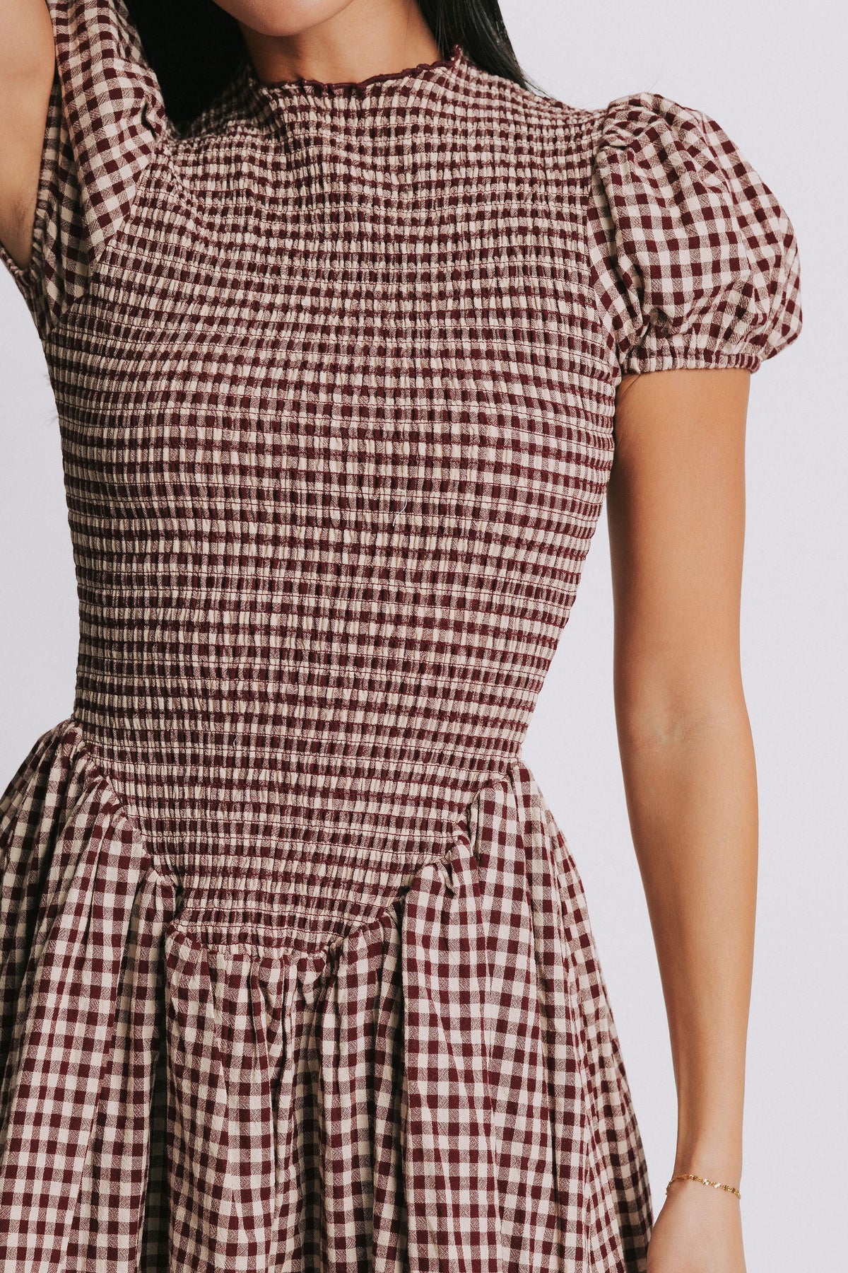 gingham mini dress with puff sleeves close