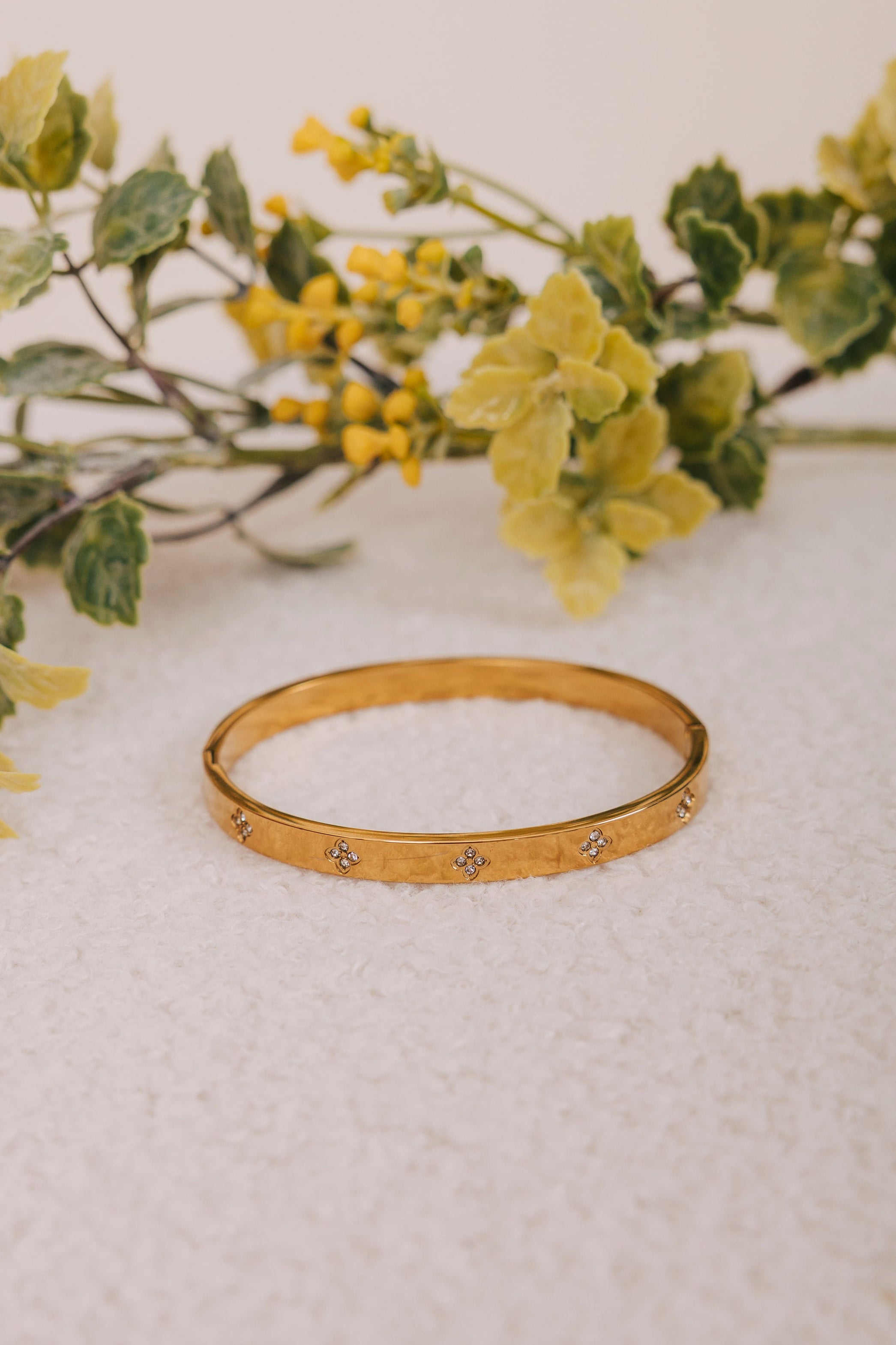 gold bracelet with diamond clovers 