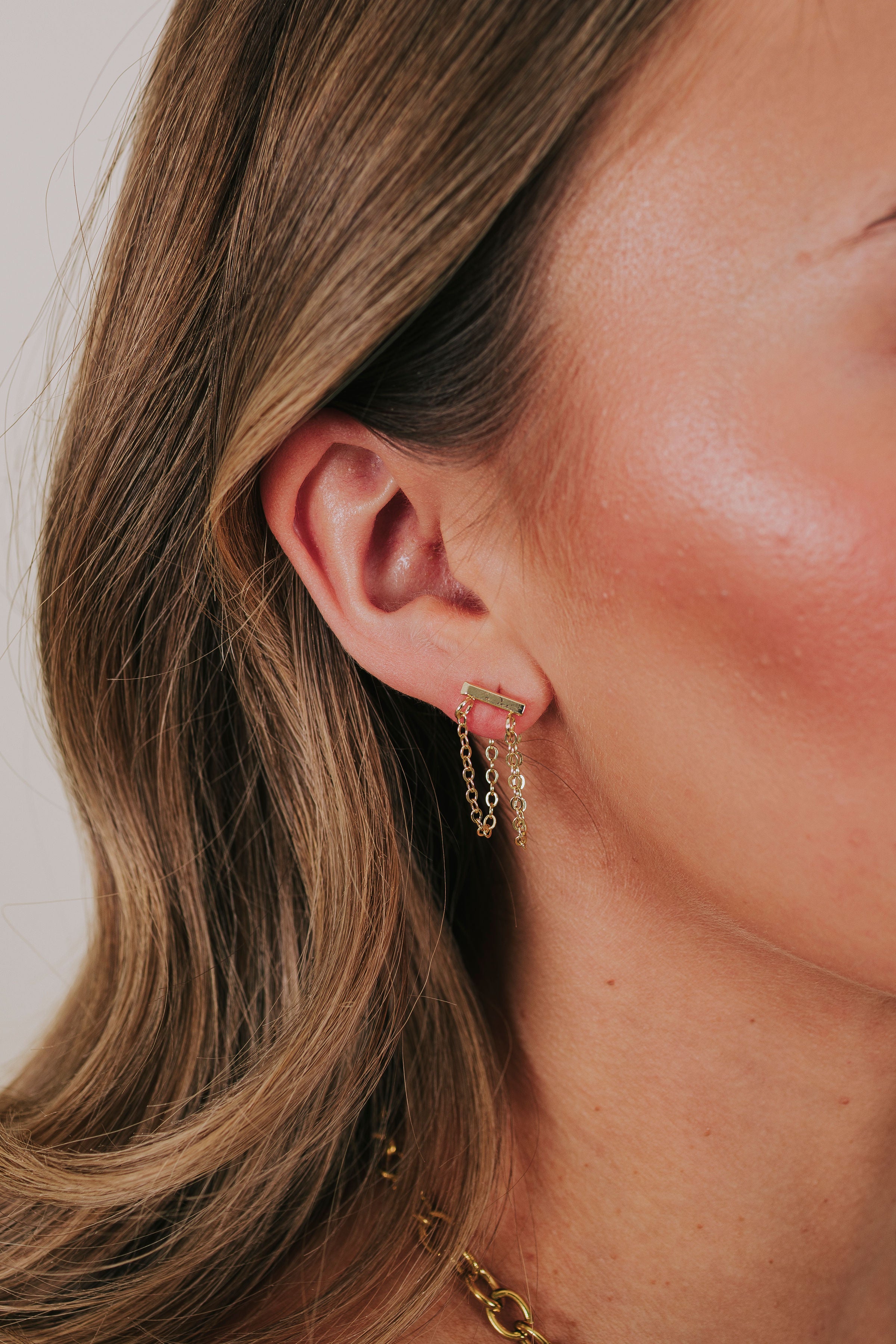 gold bar earring with dangling double chains