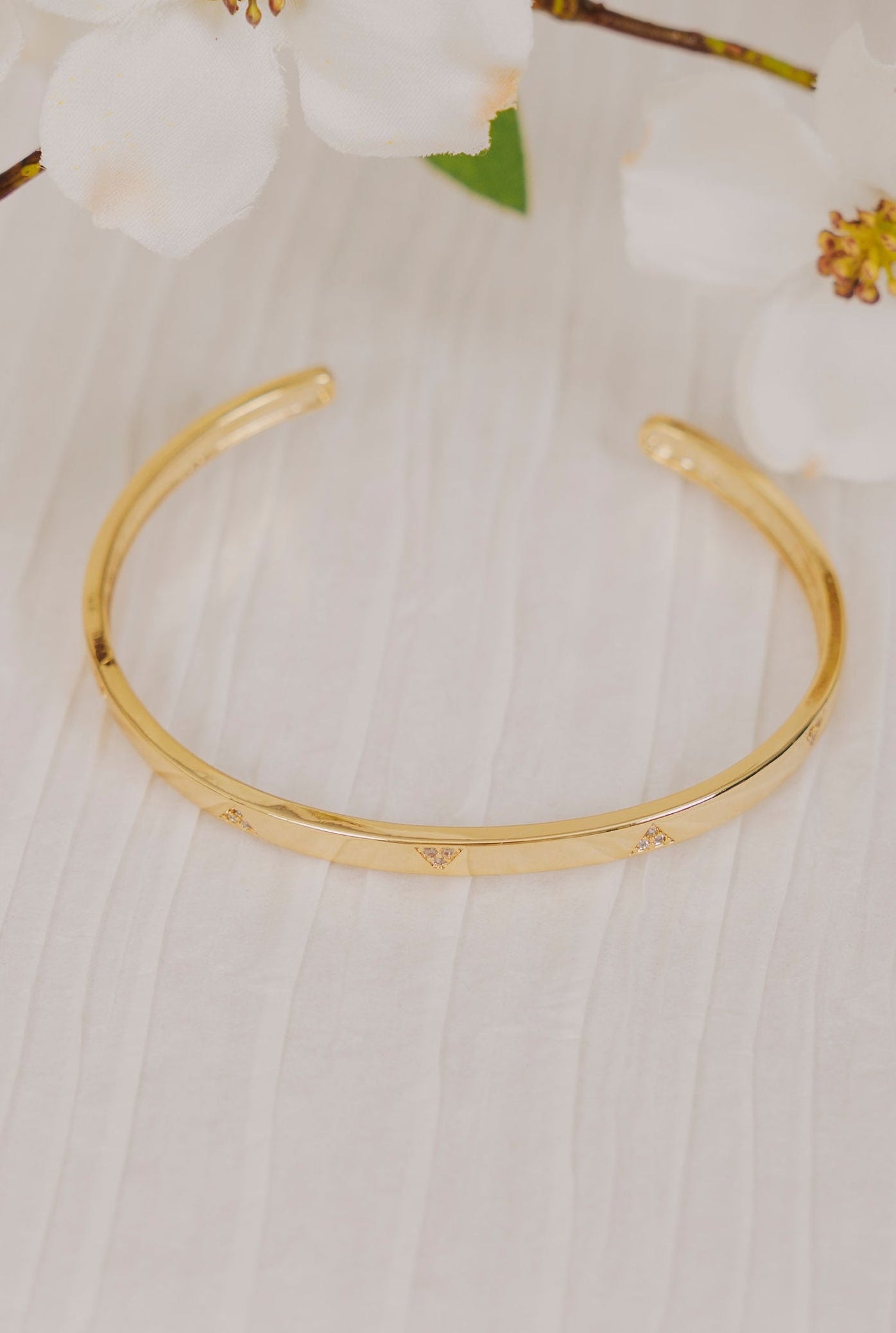 gold cuff bracelet with cubic zirconia triangles 