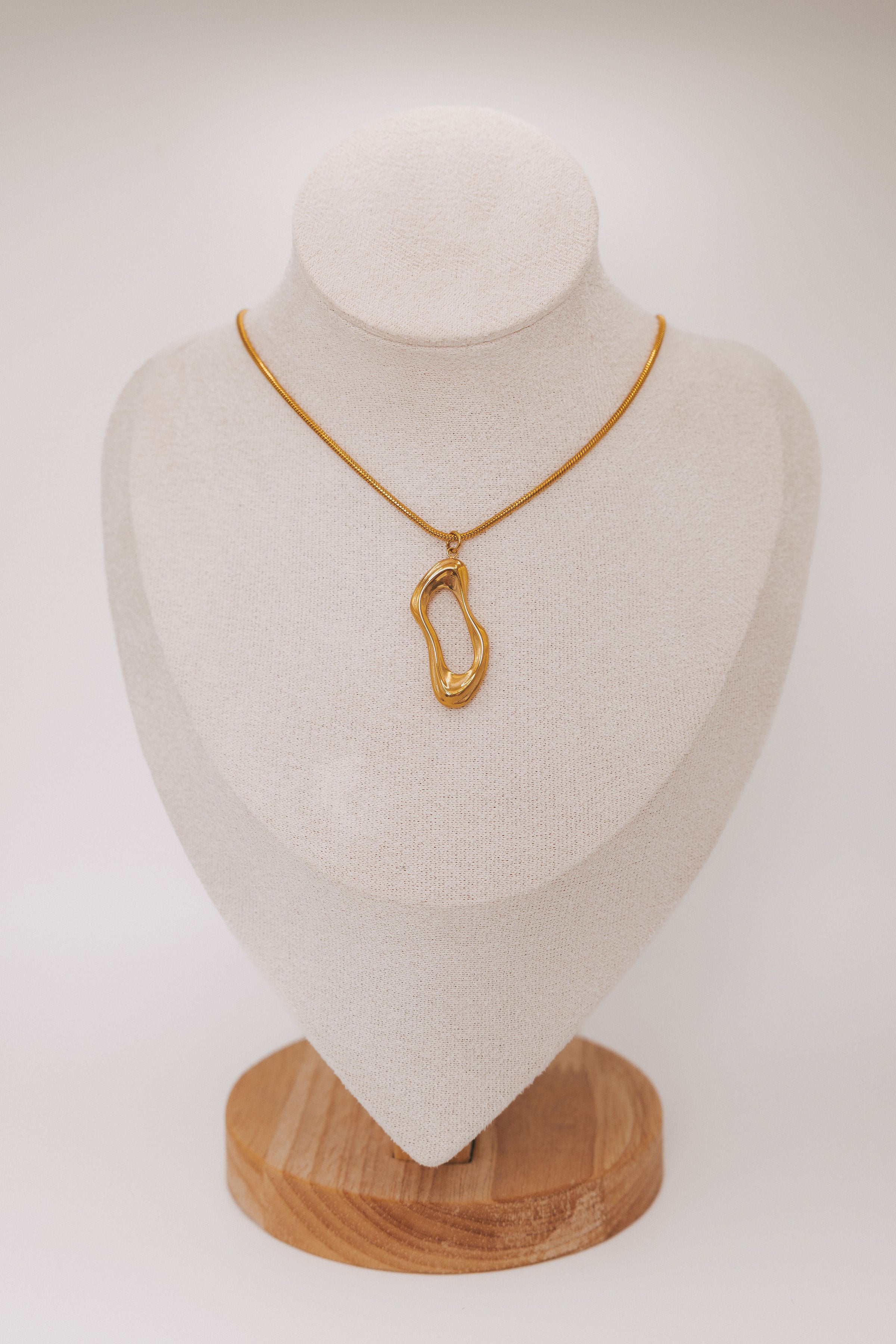 gold necklace with asymmetric pendant 