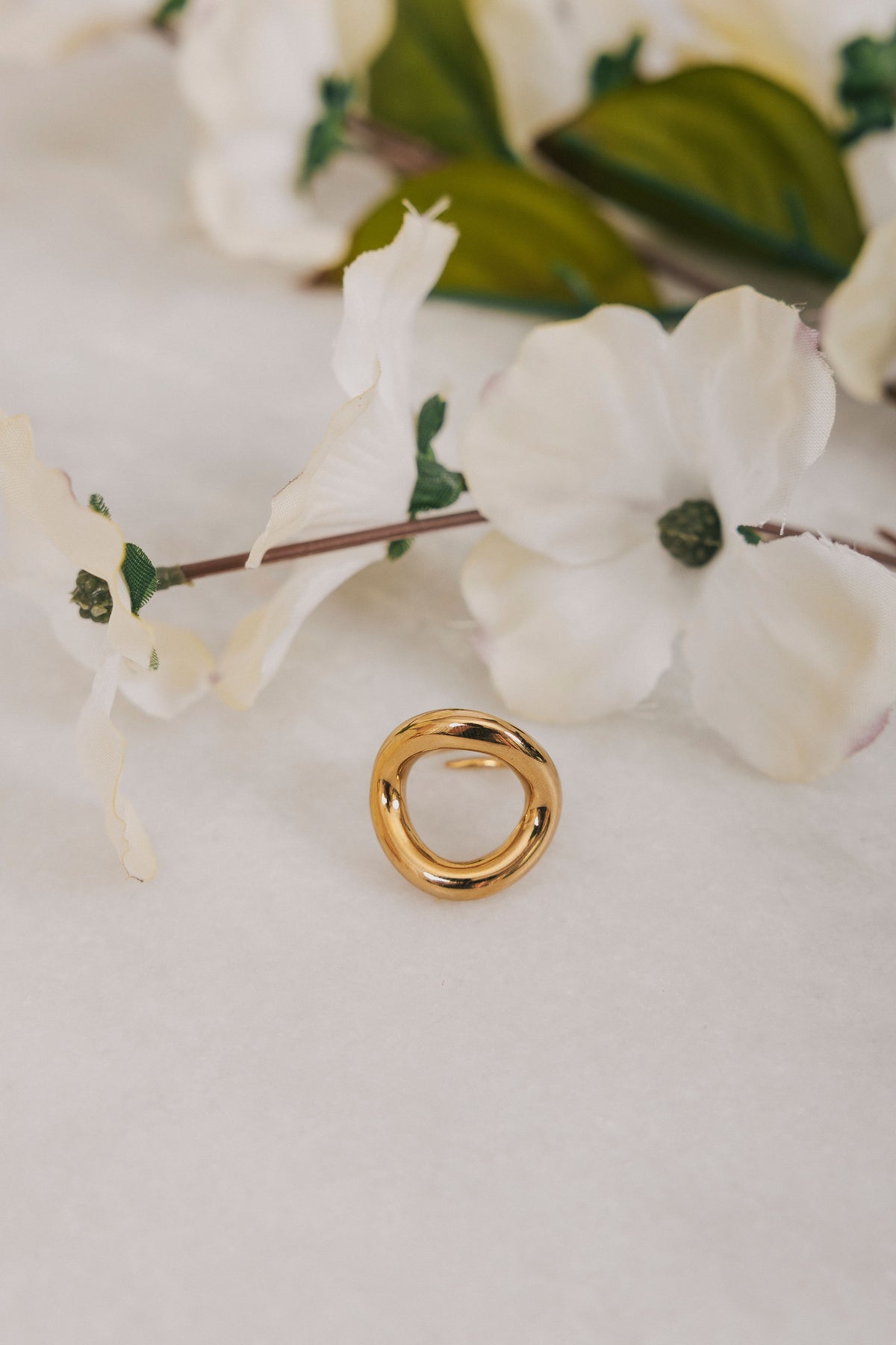 Gold circle ring with cut out empty space 
