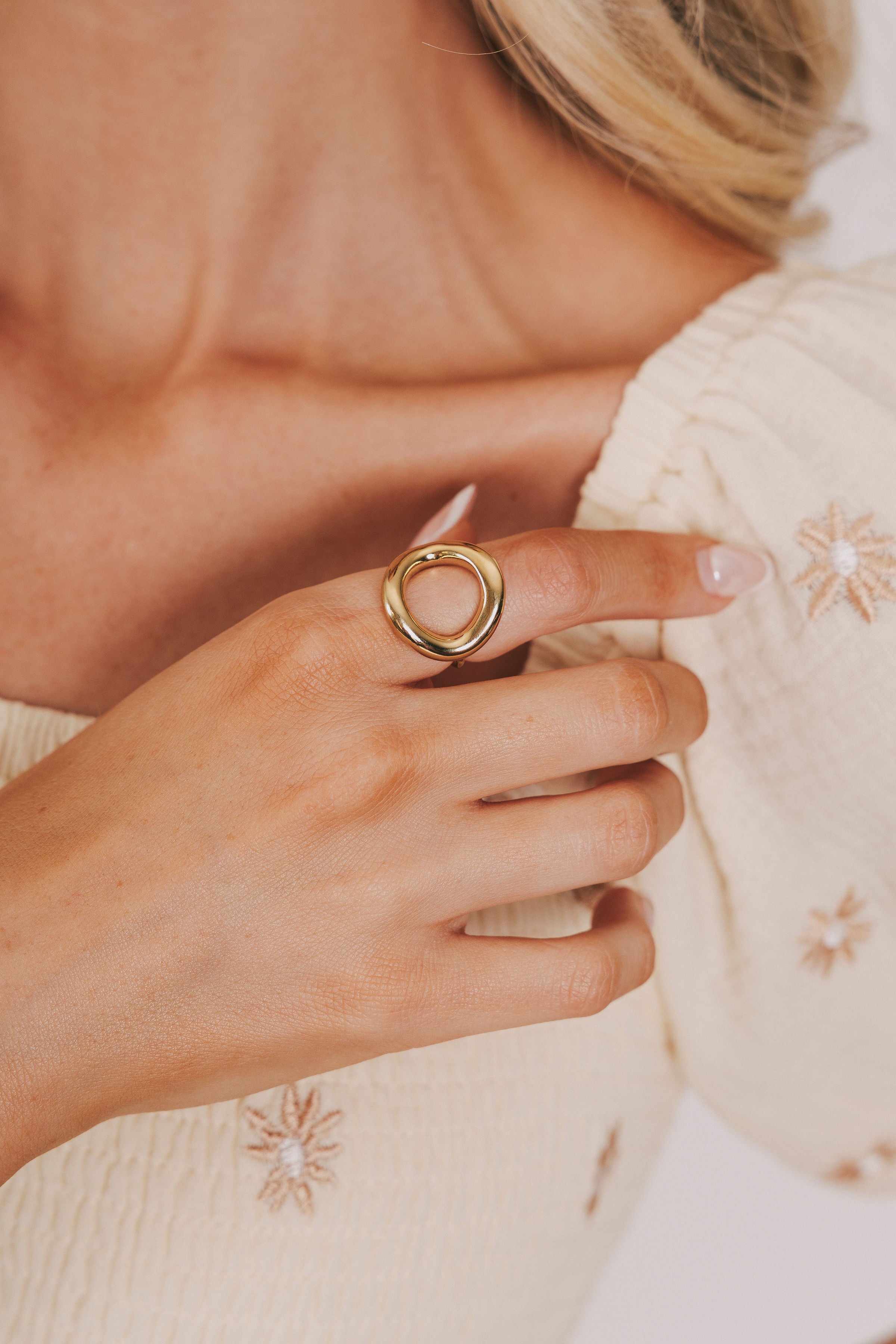 Gold circle ring with cut out empty space 