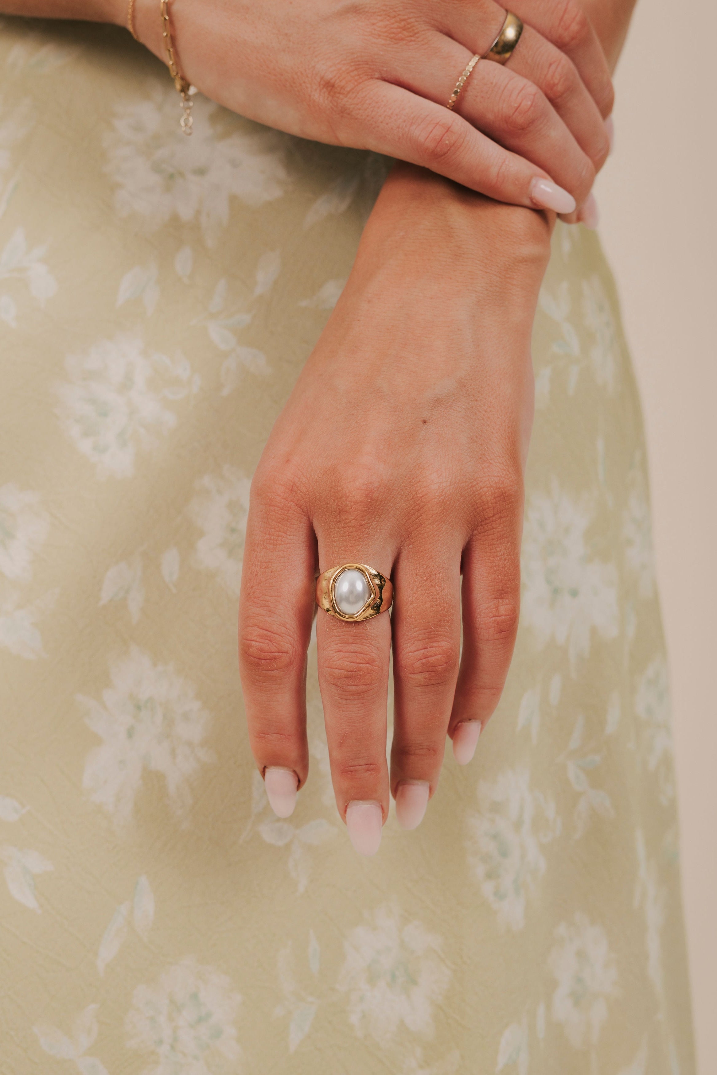 gold textured ring with oversized pearl 