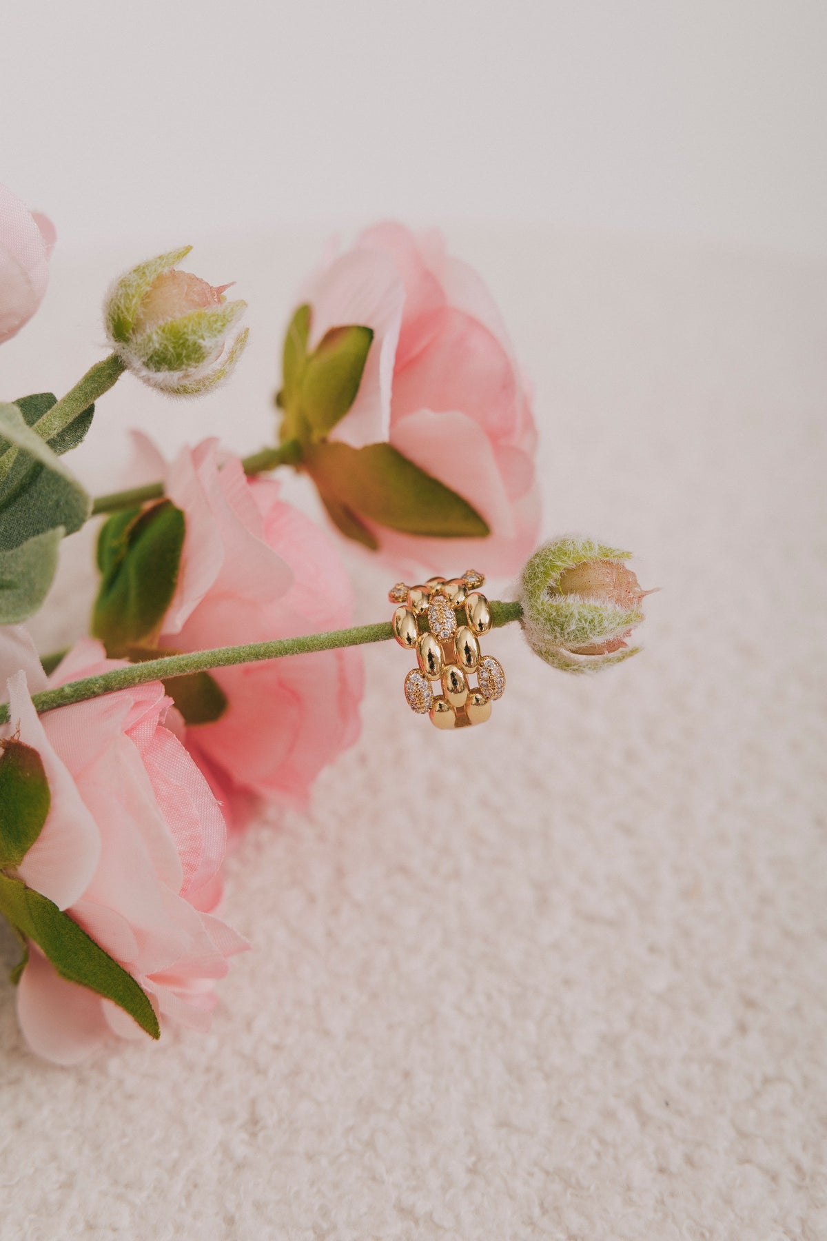 gold textured ring with cubic zirconia inlays 