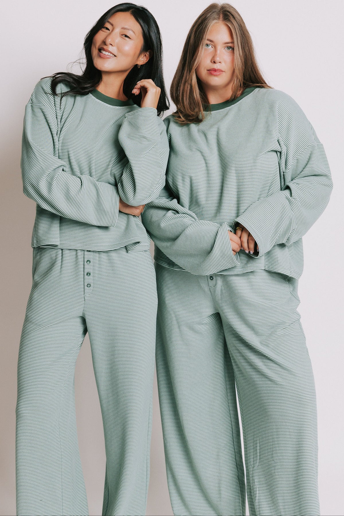 green striped long sleeve top with contrasting neckline models 