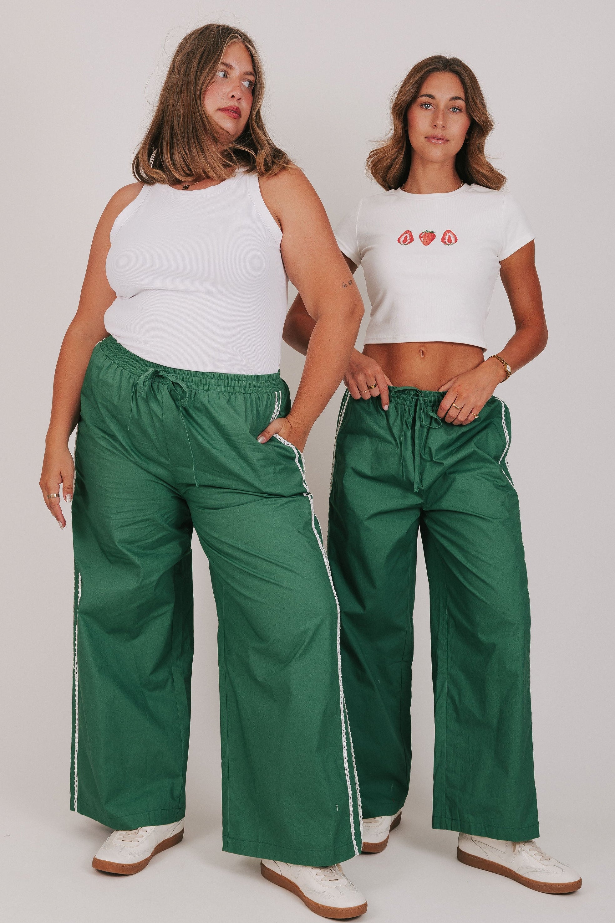 green track pants with lace edges models