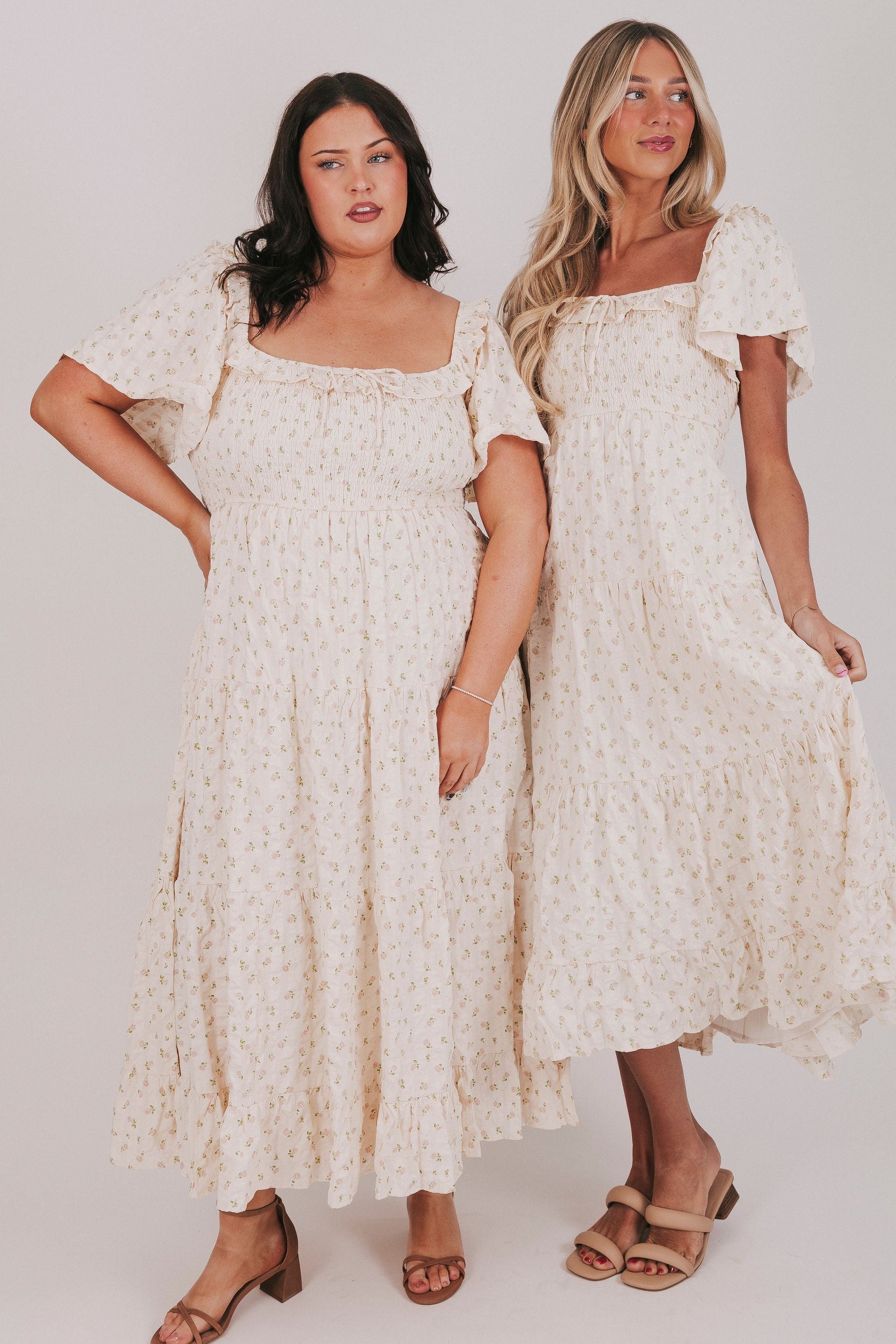 ivory floral tiered dress with flutter sleeves models 