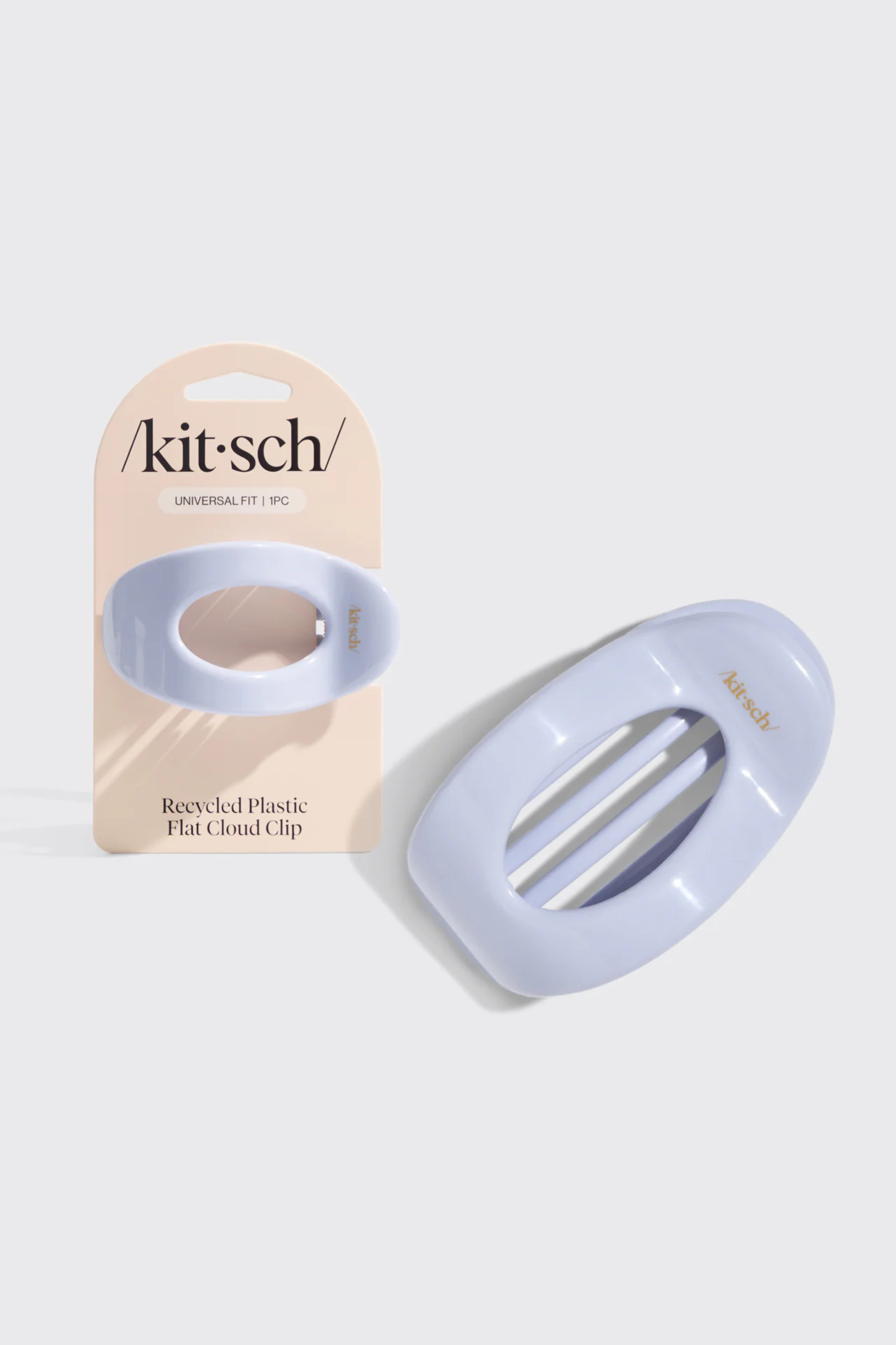 Light blue hair clip with 'kitsch' branding on a beige card against a white background