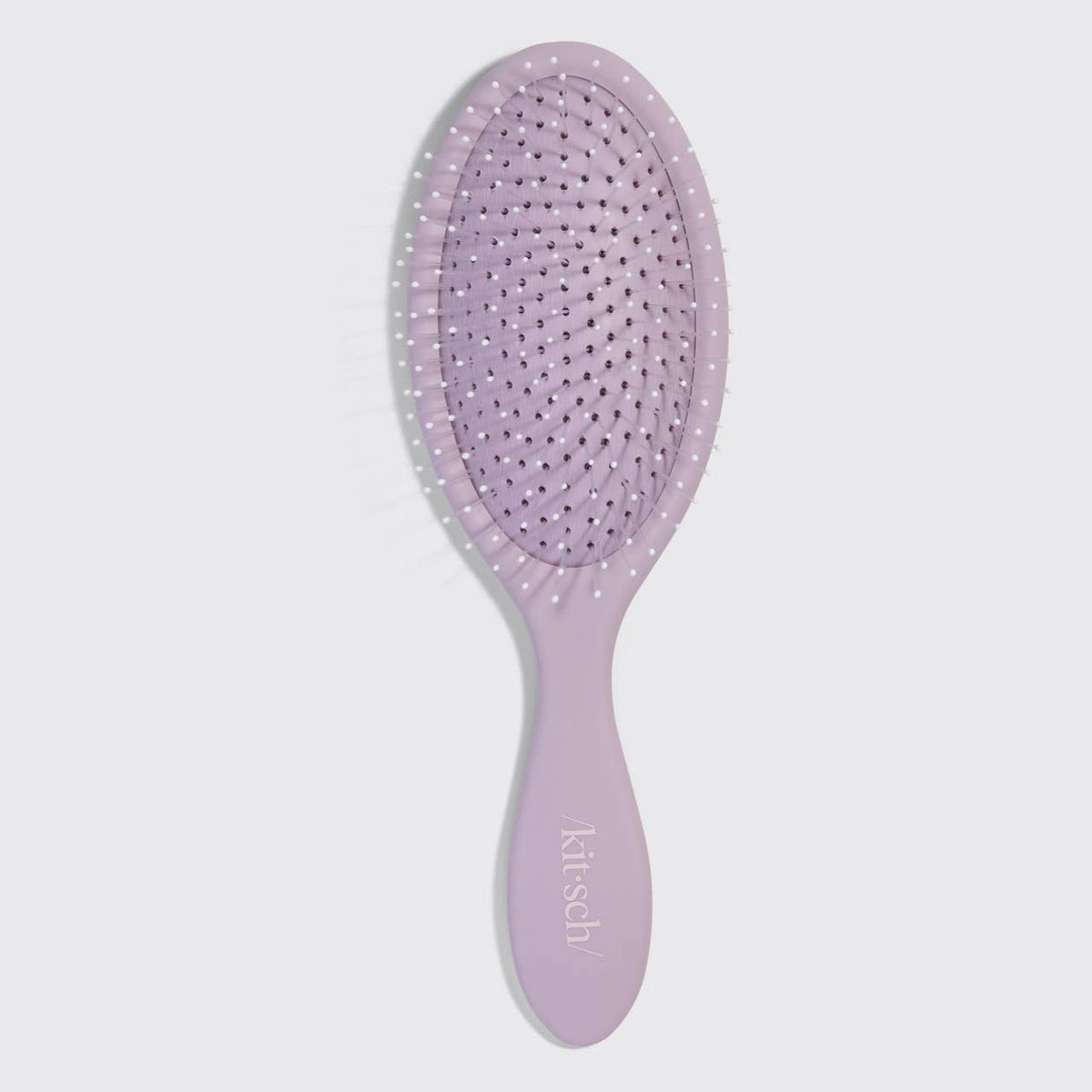 Kitsch recycled plastic detangling brush for wet/dry hair. For smoothing knots and evenly distributing hair product.