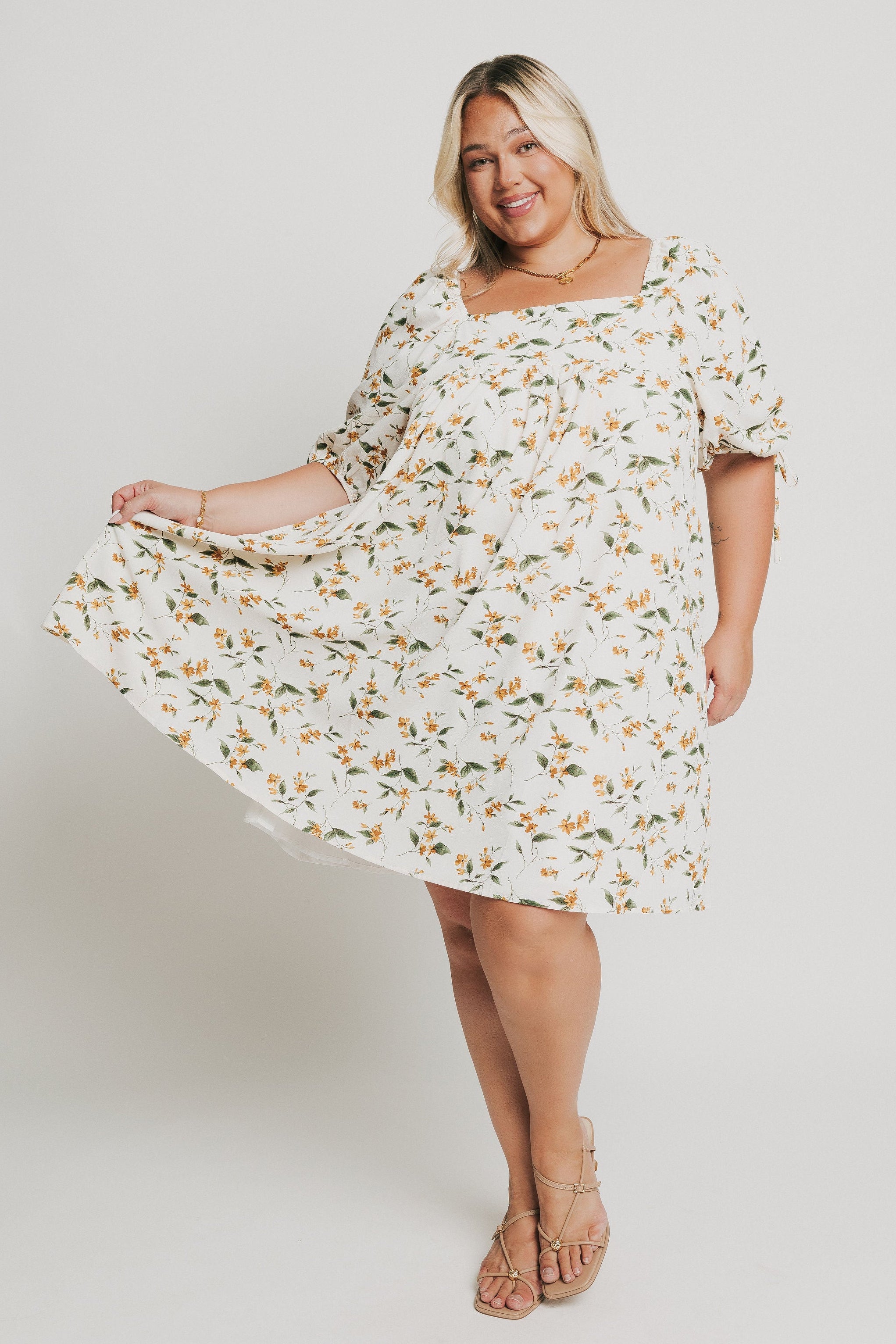 knee length floral dress with square neck and puff sleeves