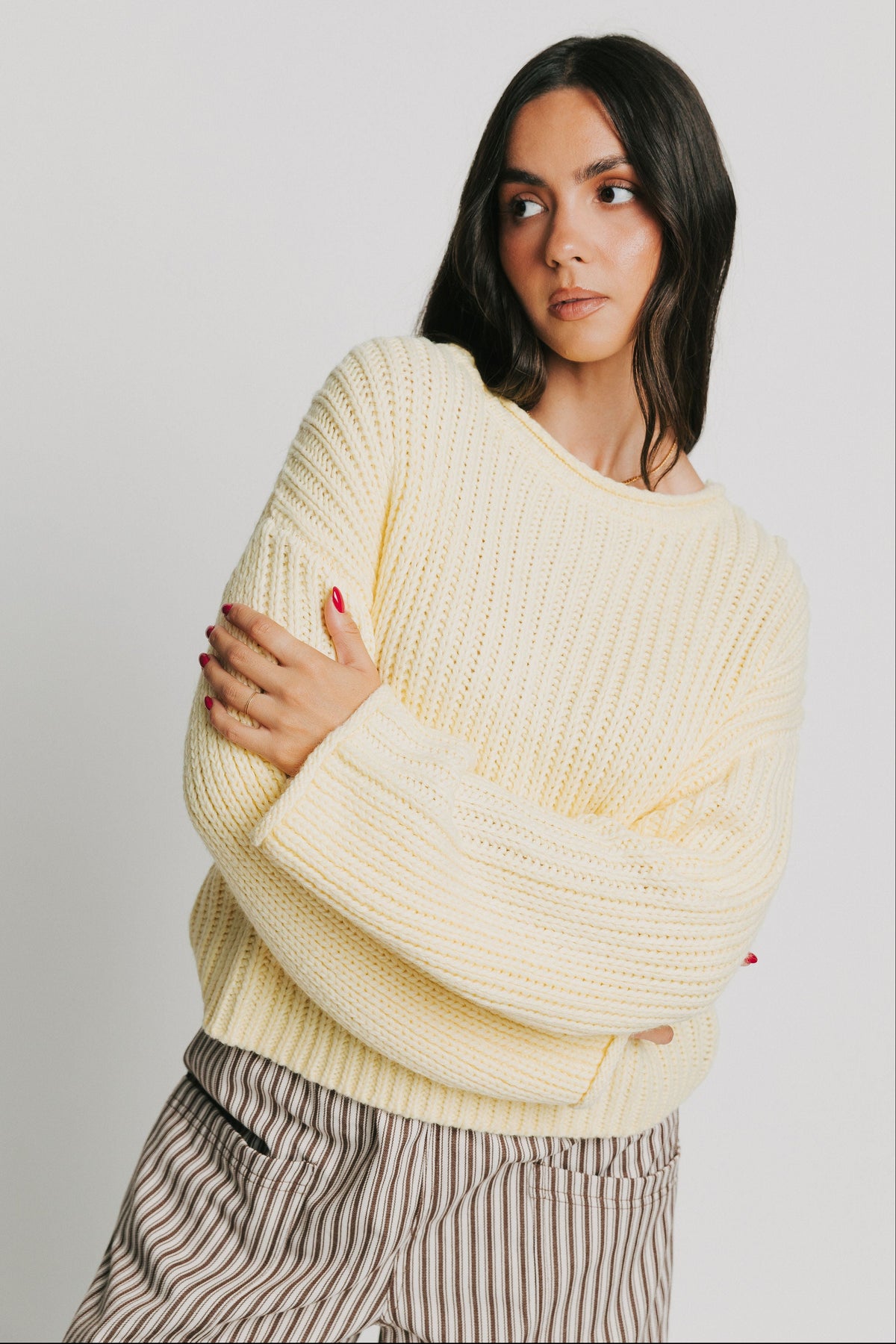large knit sweater with rolled edges yellow front