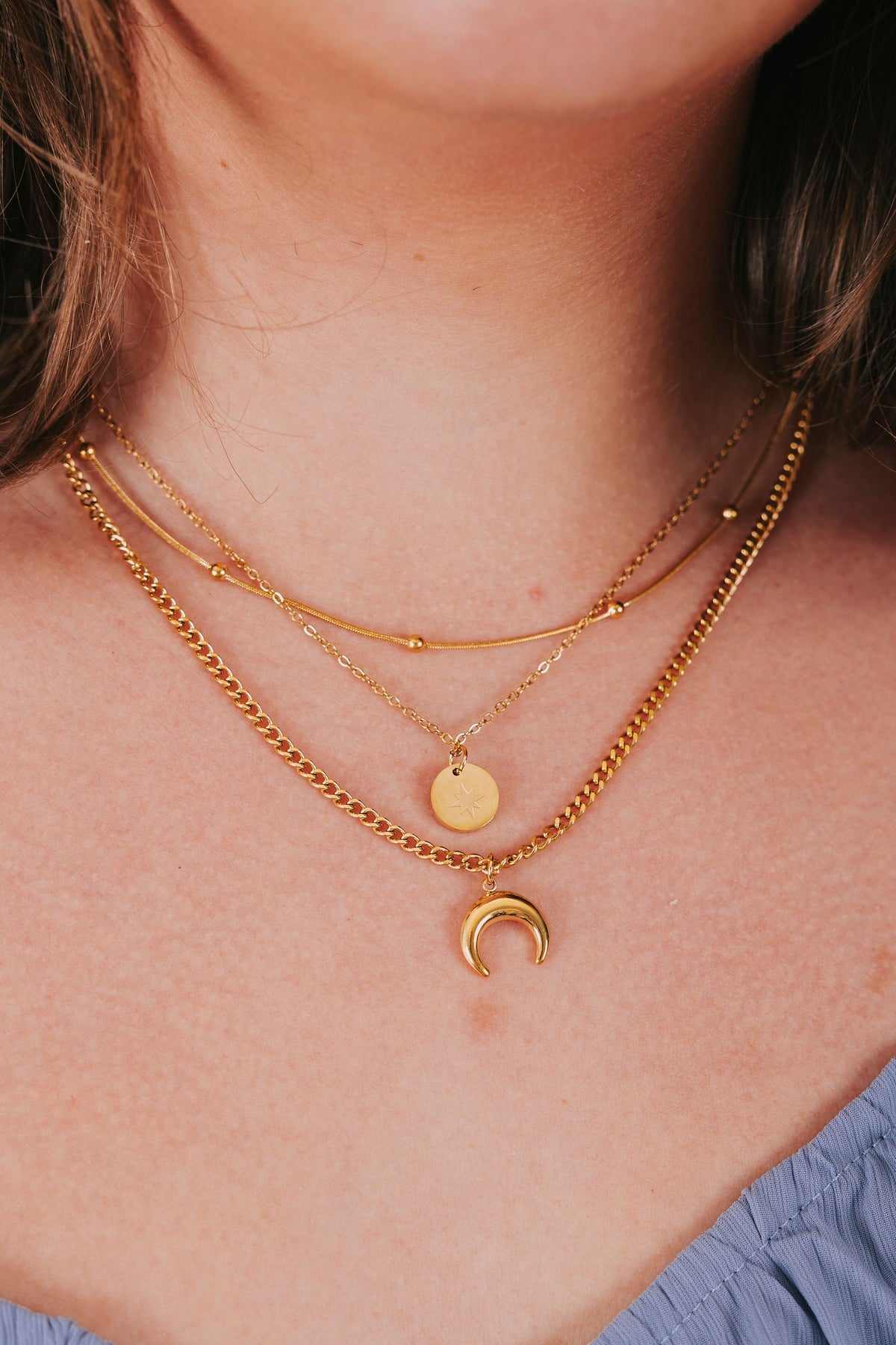 gold triple layered necklace with moon and star sun pendants 