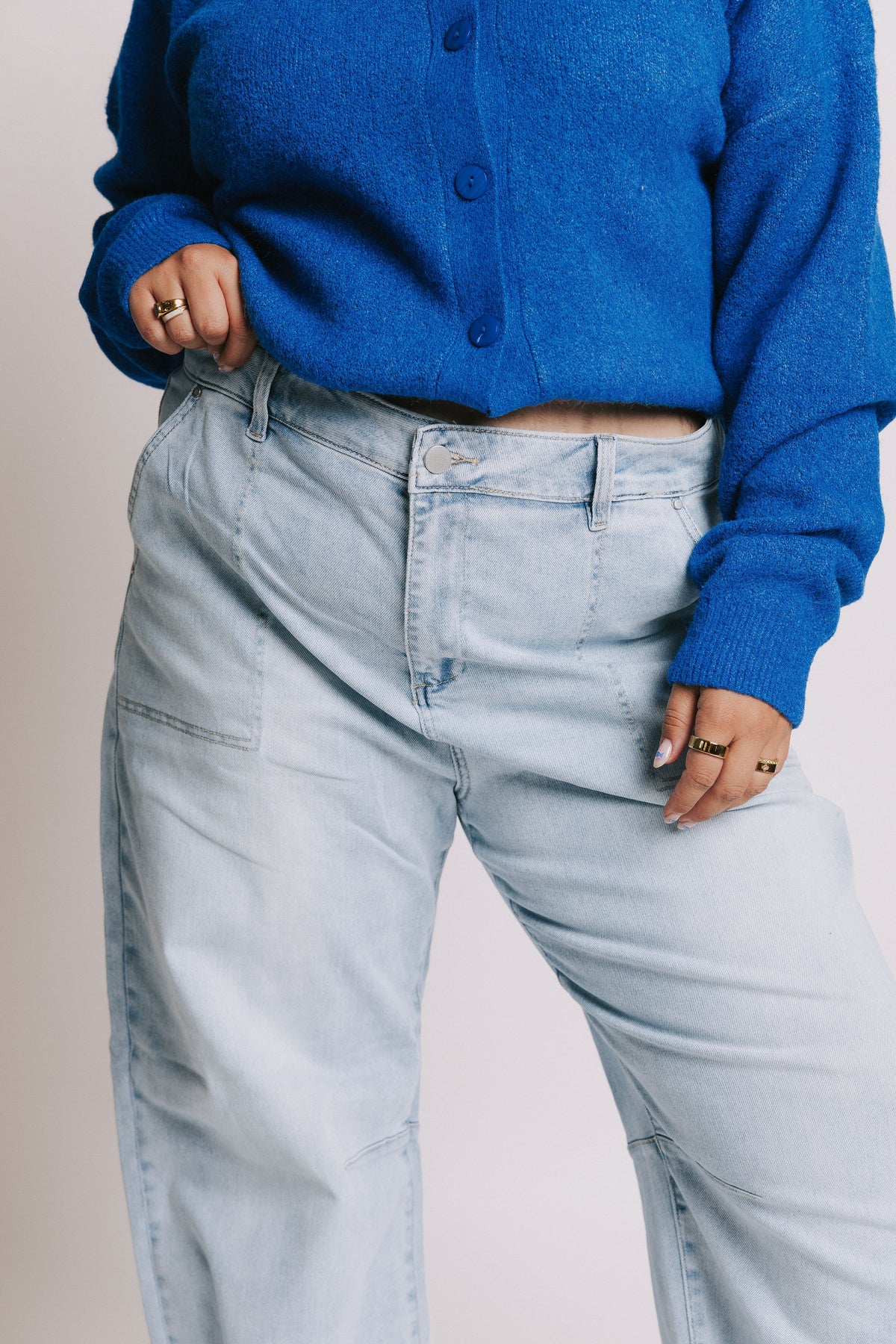 light wash barrel jeans with oversized pockets close