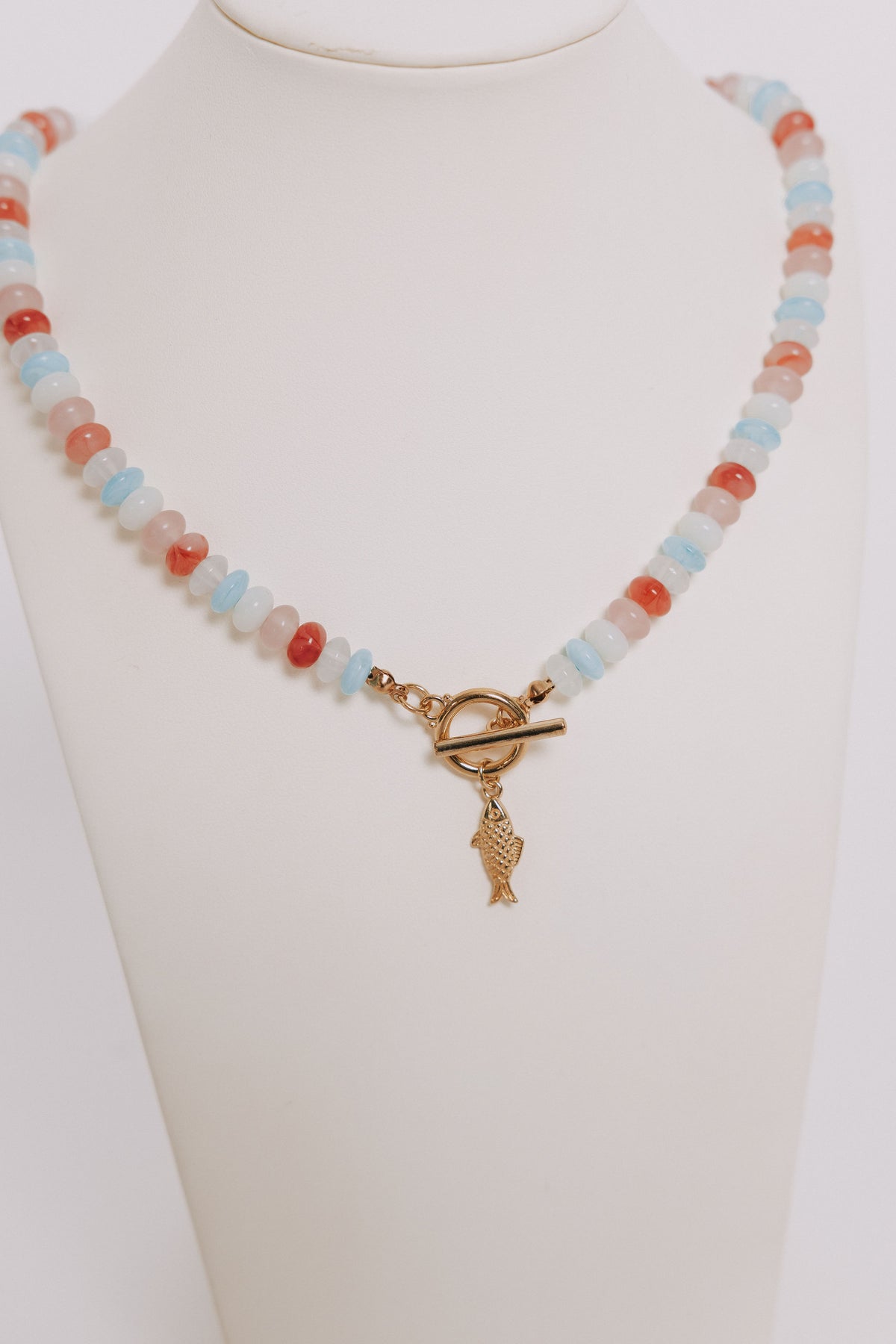 multicolored beaded necklace with fish charm 